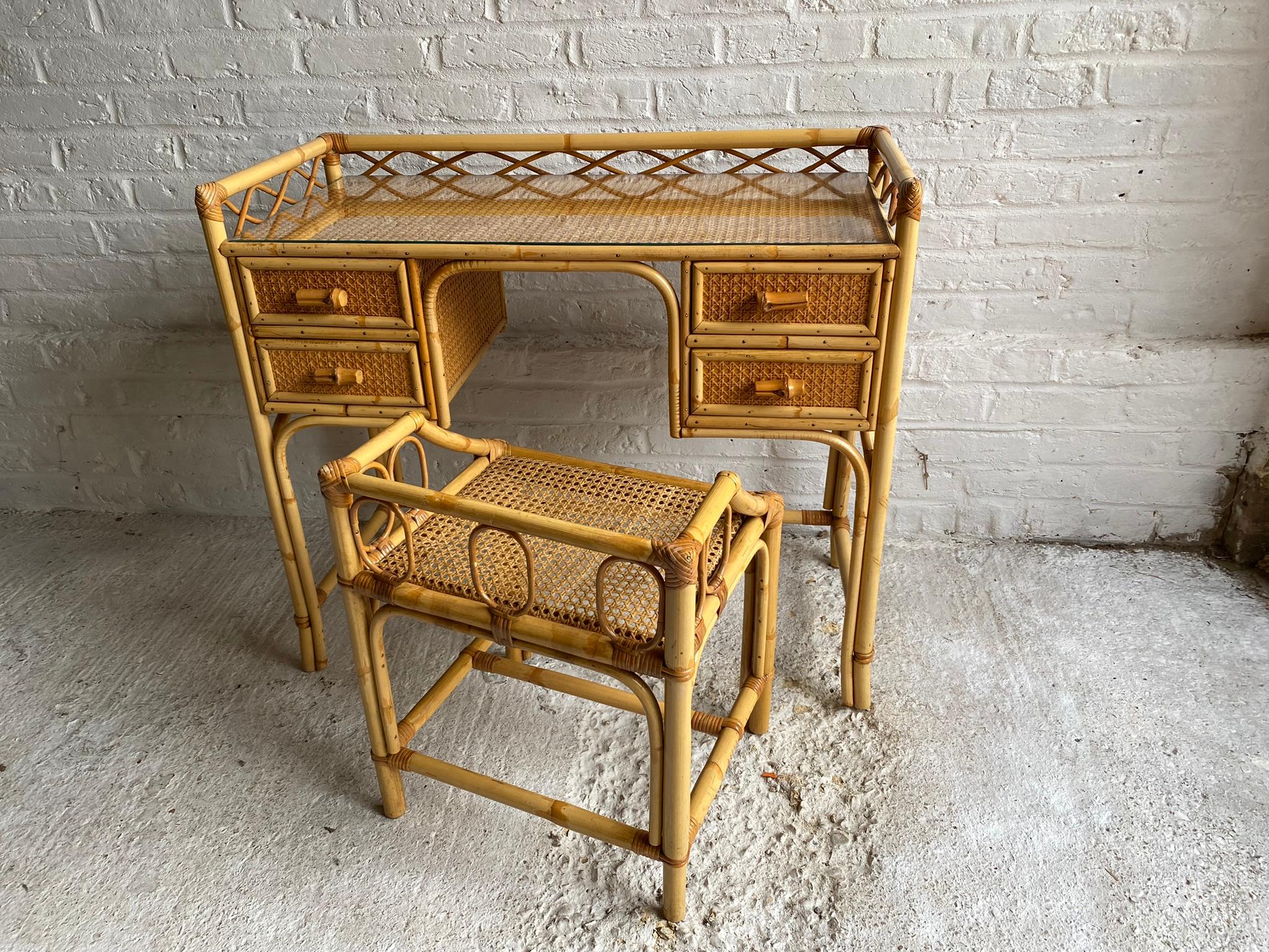Midcentury rattan cane dressing table or small desk, and stool set, England, 1970s

This is a beautiful set consisting of a dressing table or small desk, and matching stool. 
Made by English company ‘Angraves of Leicester’, who manufactured the