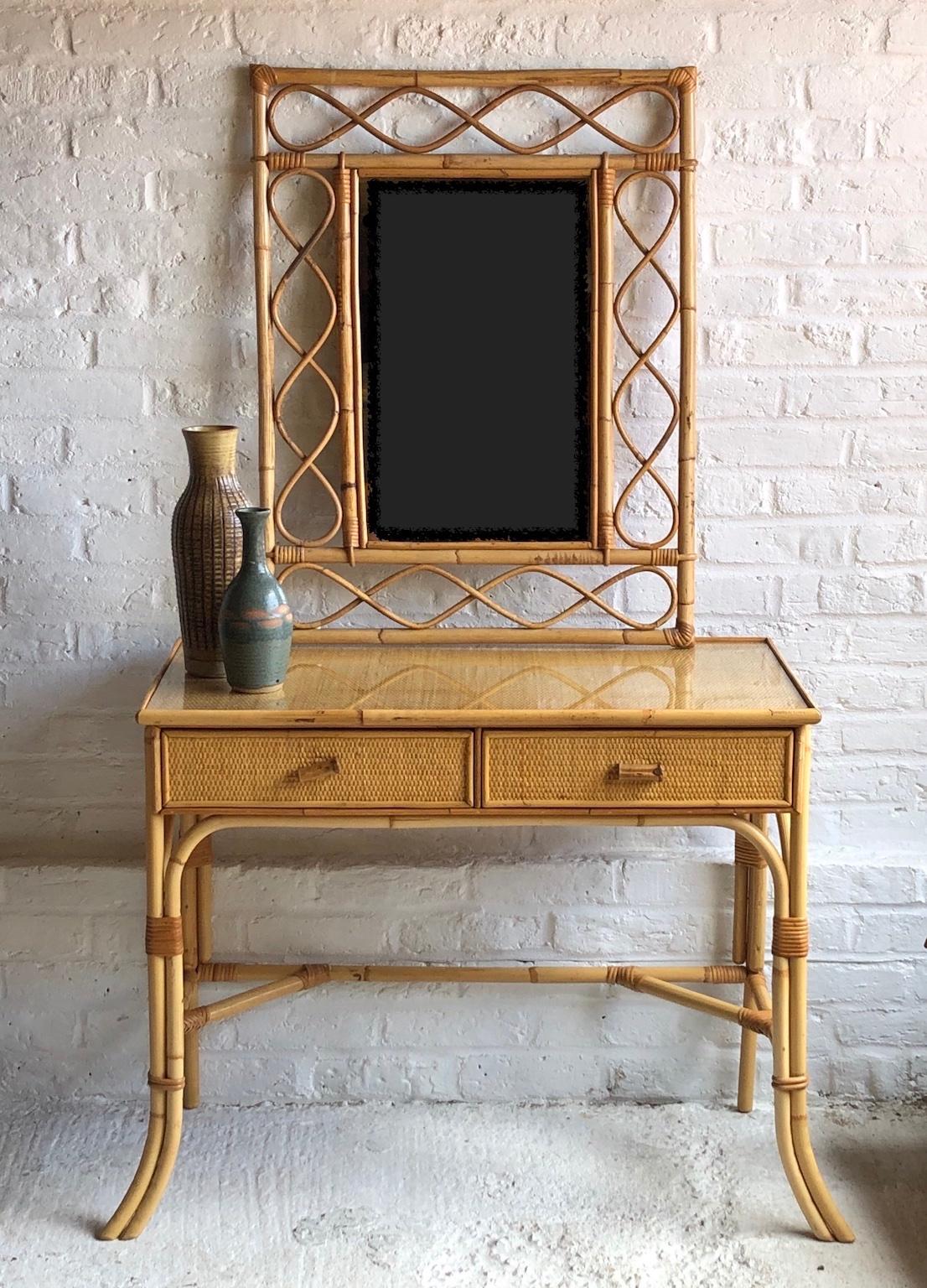 Midcentury rattan cane dressing table or small desk, Italy, 1970s

This is a stunning rattan dressing table that can also be used as a small desk, or hall table.
The quality and craftsmanship is superb. Attributed to Dal Vera

The dressing