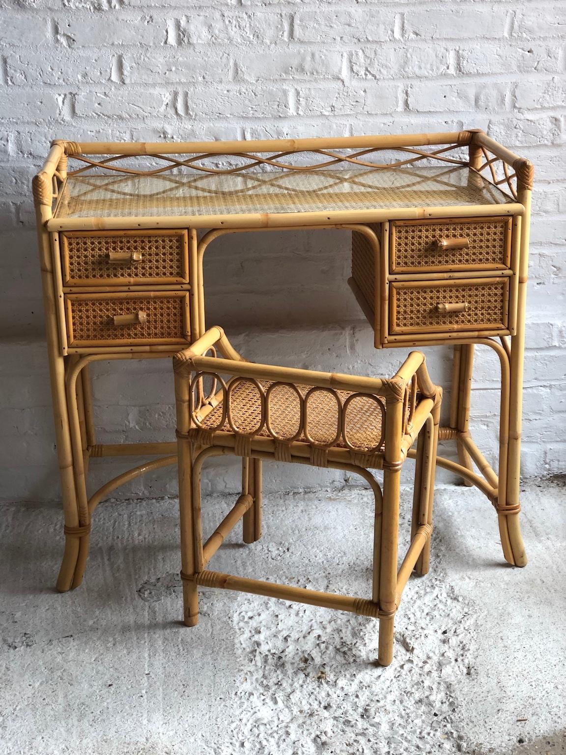 Midcentury rattan cane dressing table or small desk, stool and mirror set, England, 1970s

This is a beautiful set consisting of a dressing table or small desk, matching stool and vanity mirror. 
Made by English company ‘Angraves of Leicester’, who