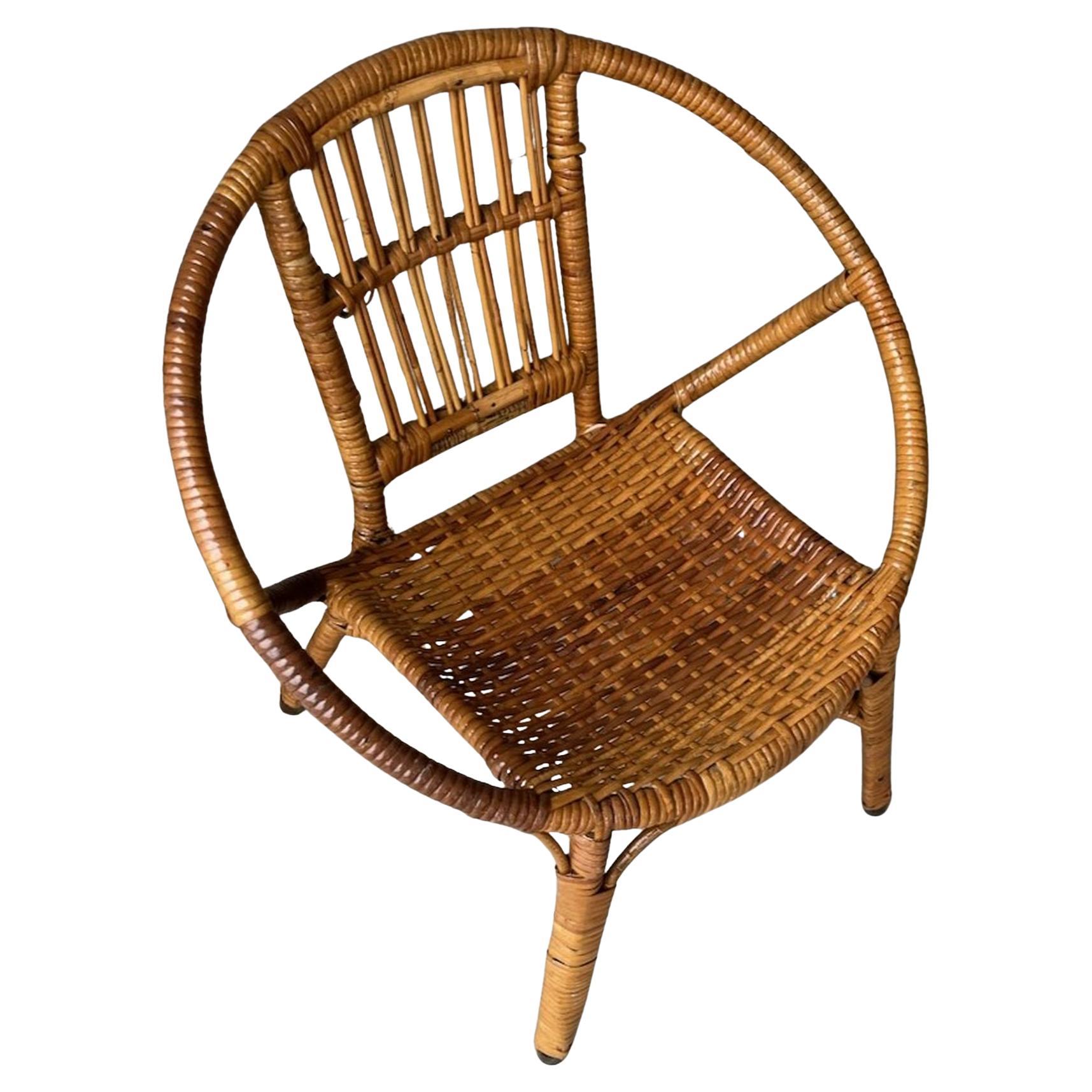 Early 20thc Rattan Child's Peacock Chair. wonderful shape and condition. Hand Woven seats. beautiful patina. Leather cushion is being made for this chair.