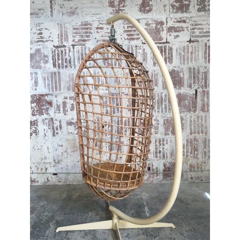 Vintage rattan hanging pod chair includes original steel stand. Also includes attached hook and chain for use without stand. Good vintage condition with minor age-appropriate wear.
Chair alone measures 17.5