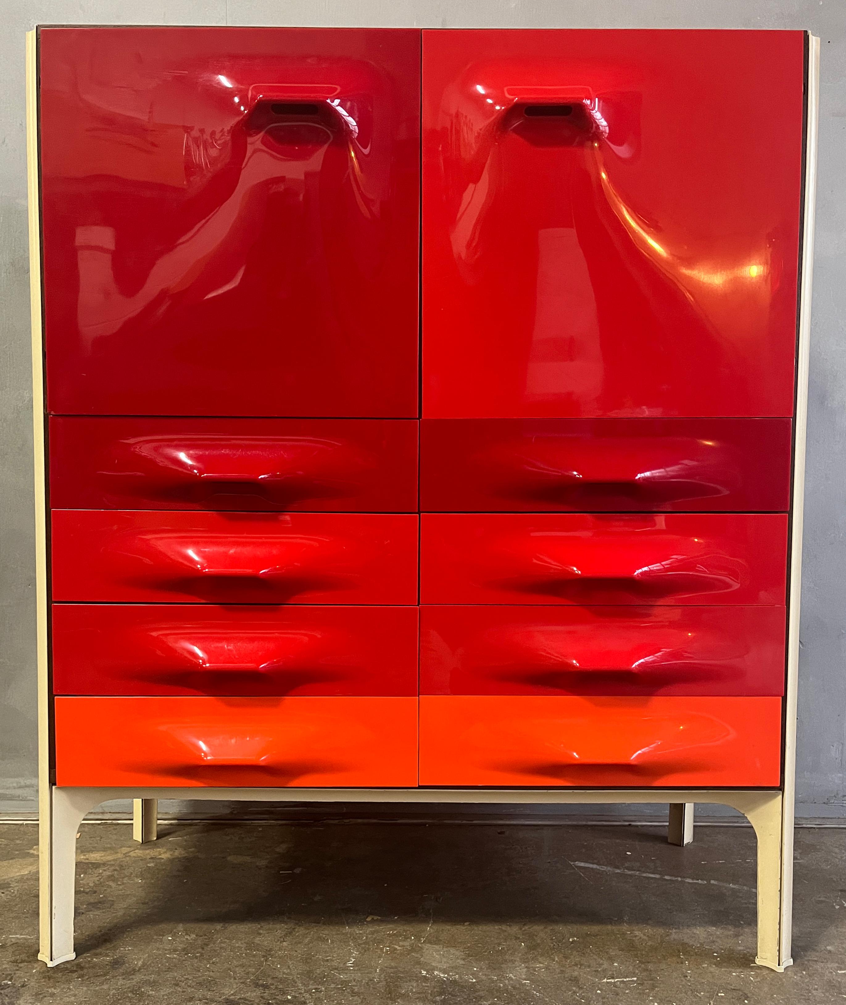 Mid-century Raymond Loewy DF-2000 dresser for Doubinsky Frères, France in 1969. Hard to find red fronts.
These cabinets almost always have chips to the panels. This one is very clean with only one minor worn down corner to one panel as shown in