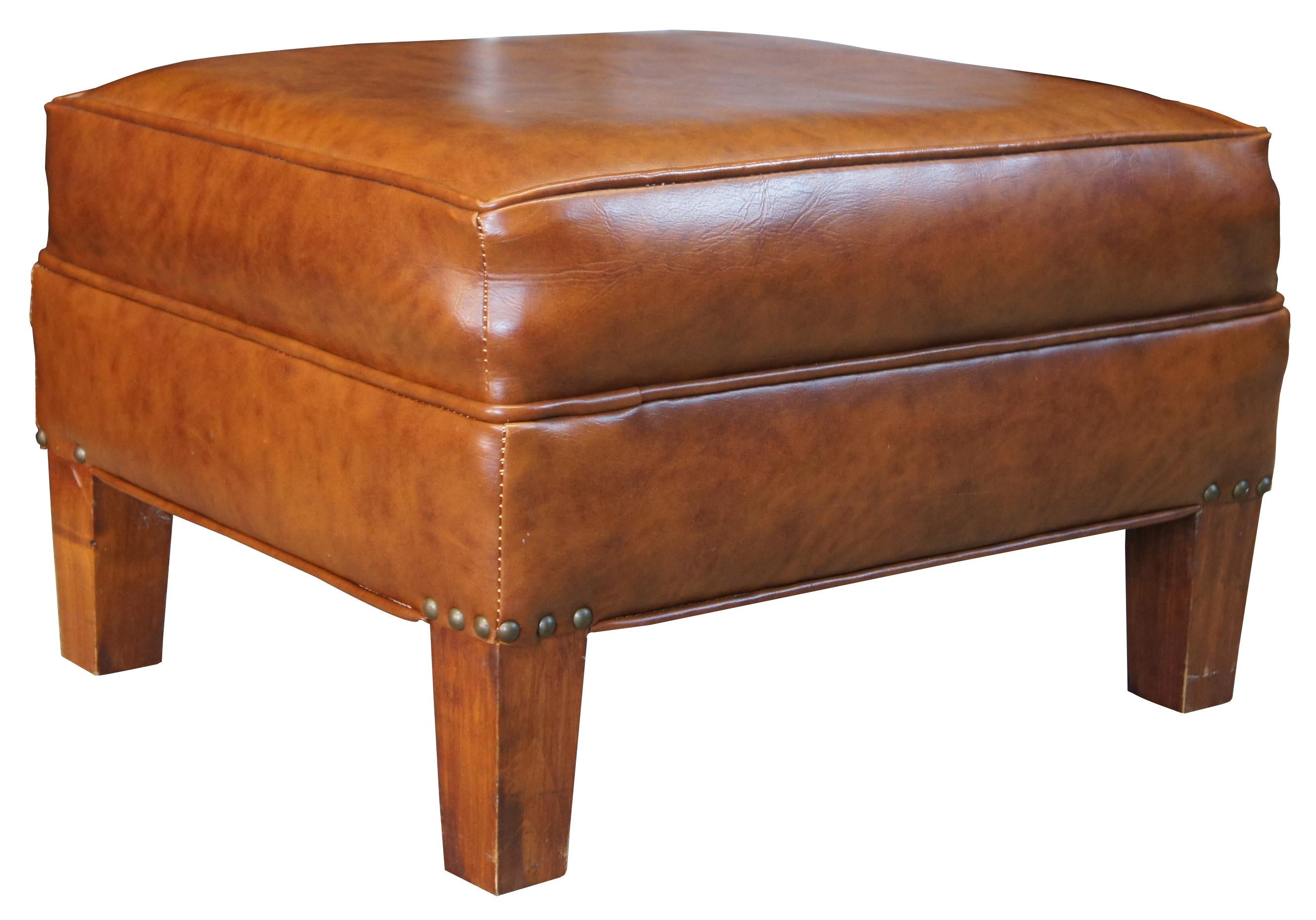 Retro light brown leather ottoman, circa 1960s. Rectangular form with square tapered legs.