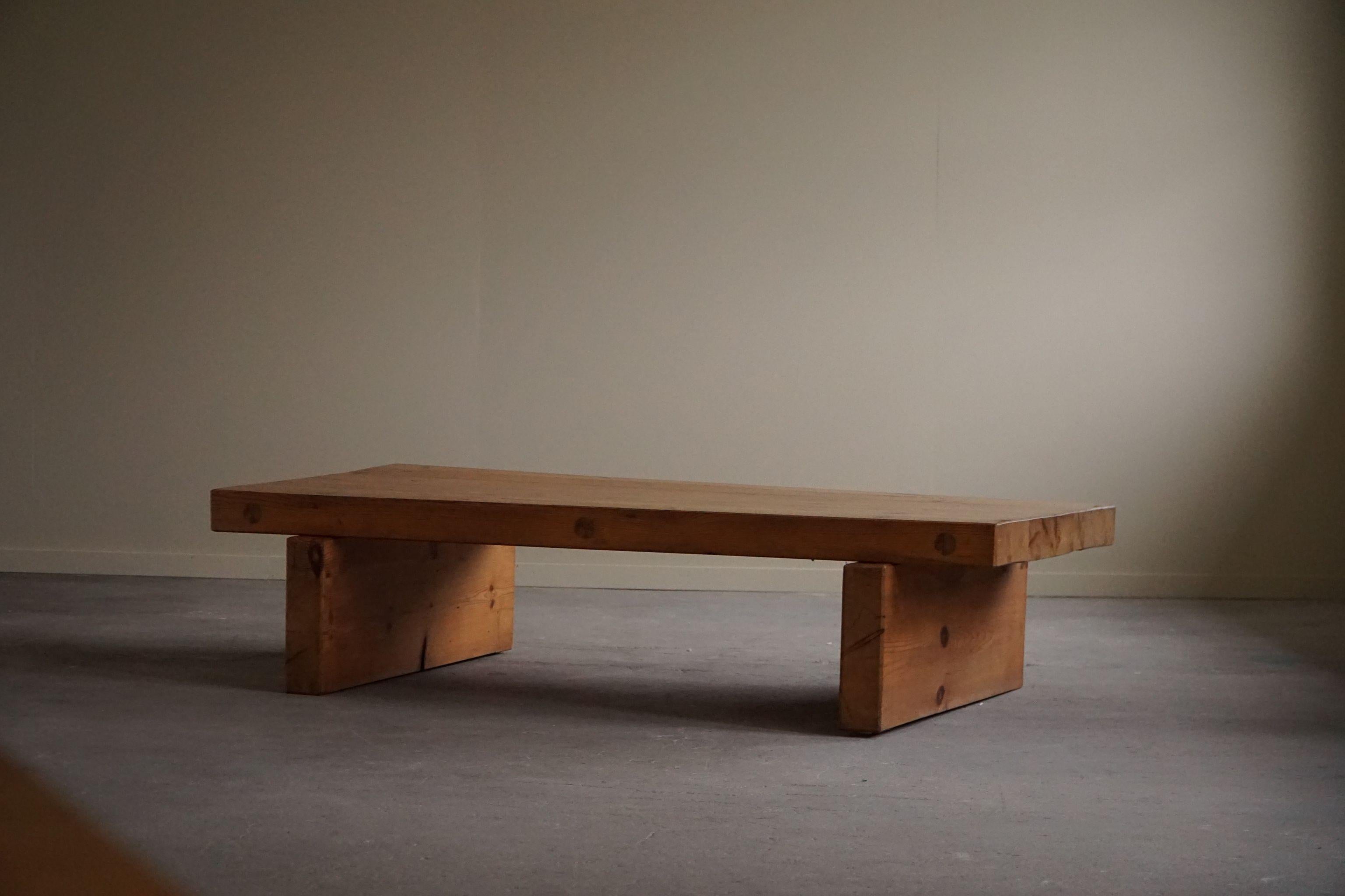 Swedish modern rectangular coffee table in solid pine. Made by Roland Wilhelmsson as part of hes own production made for Ågesta. Stamped and signed 1969. Great craftmanship and such nice details visible shown in this fine brutalist table.

This