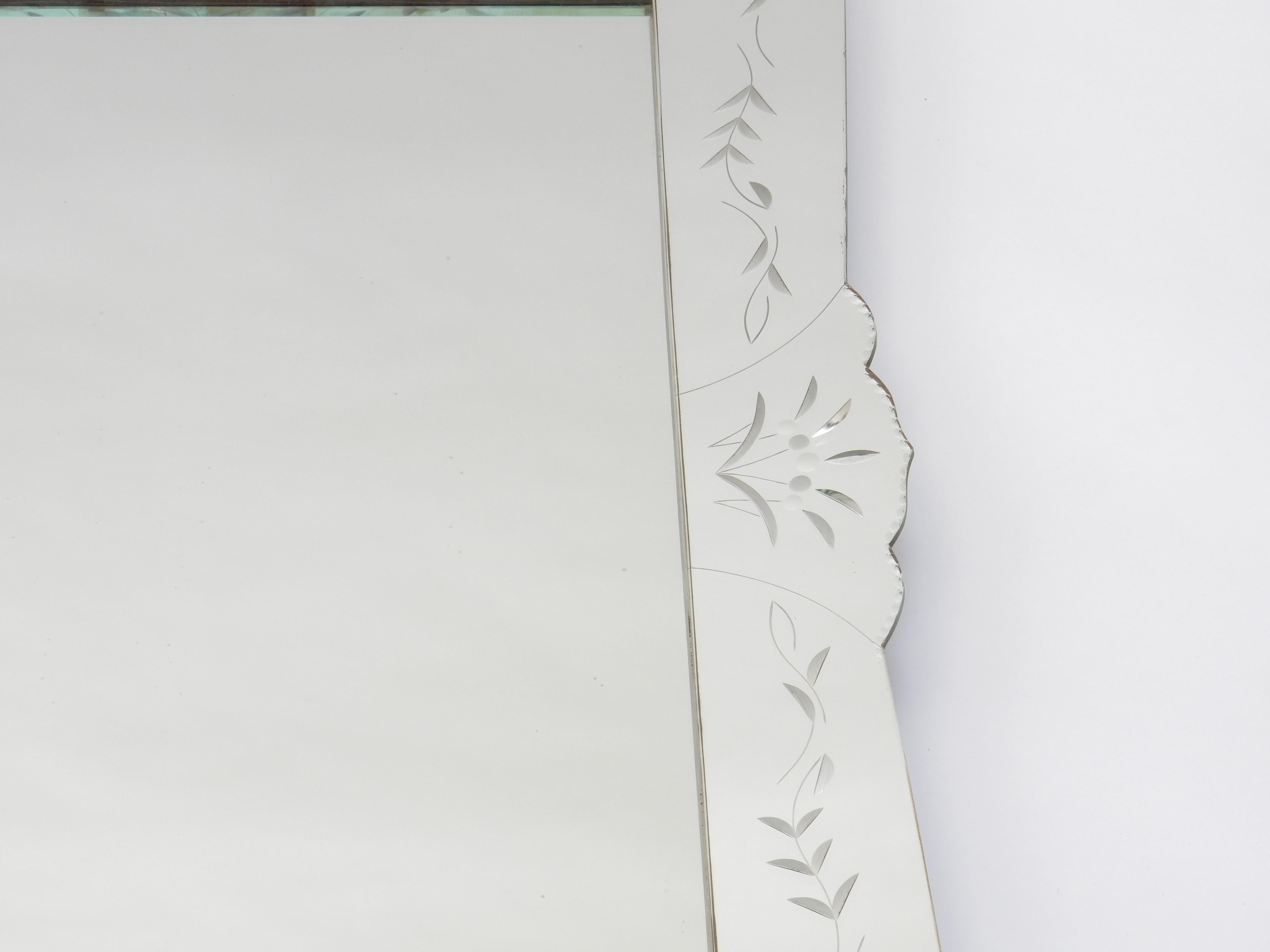 Venetian style mirror with reverse etched design. Serpentine border. Wooden back. Fine quality. May be hung vertically or horizontally. Mirror is currently prepared to hang vertically.