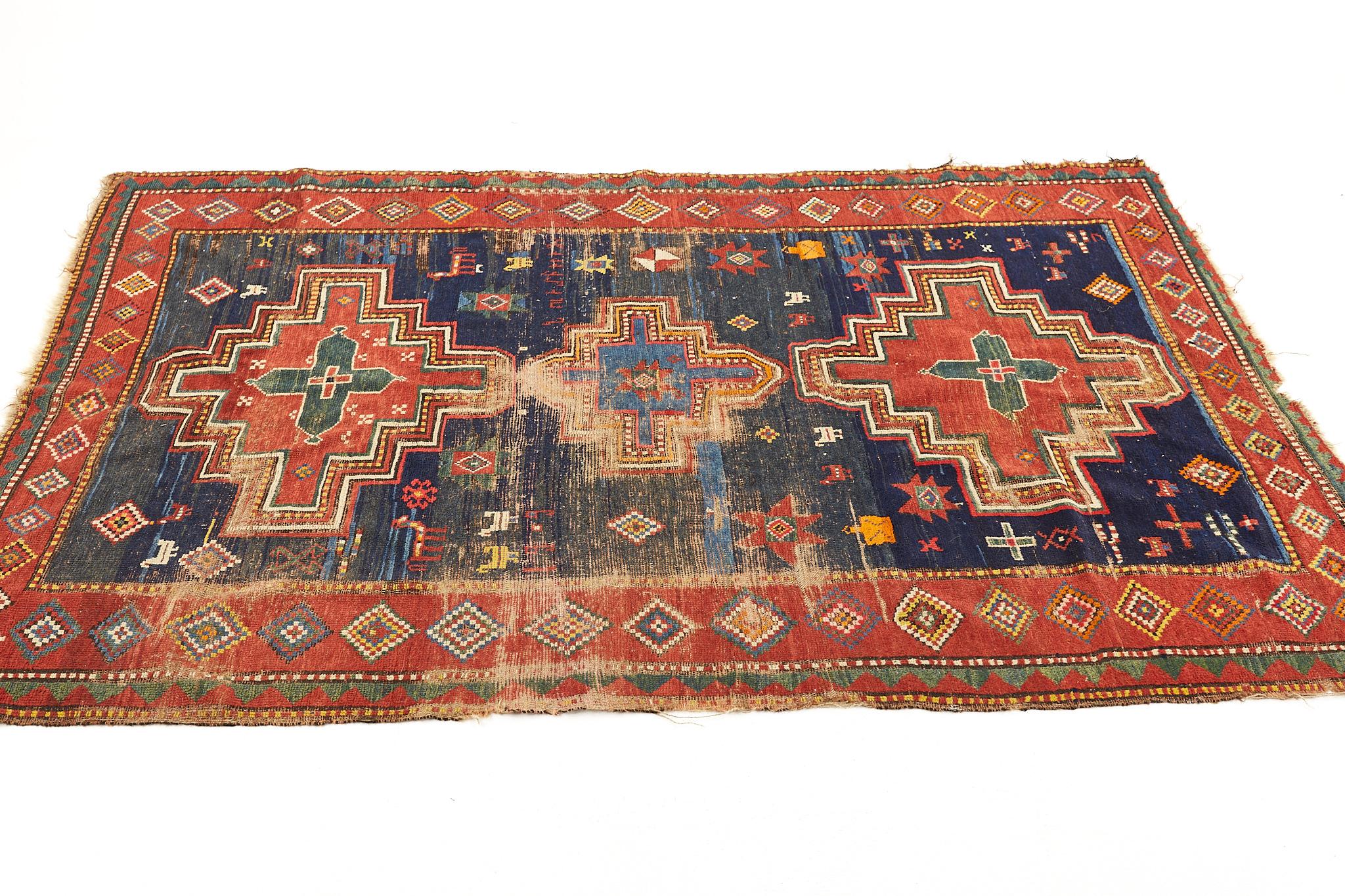 Mid Century red blue and green low pile wool rug

This Rug is in good vintage condition

This rug measures: 84 wide x 54 inches deep

We take our photos in a controlled lighting studio to show as much detail as possible. We do not photoshop