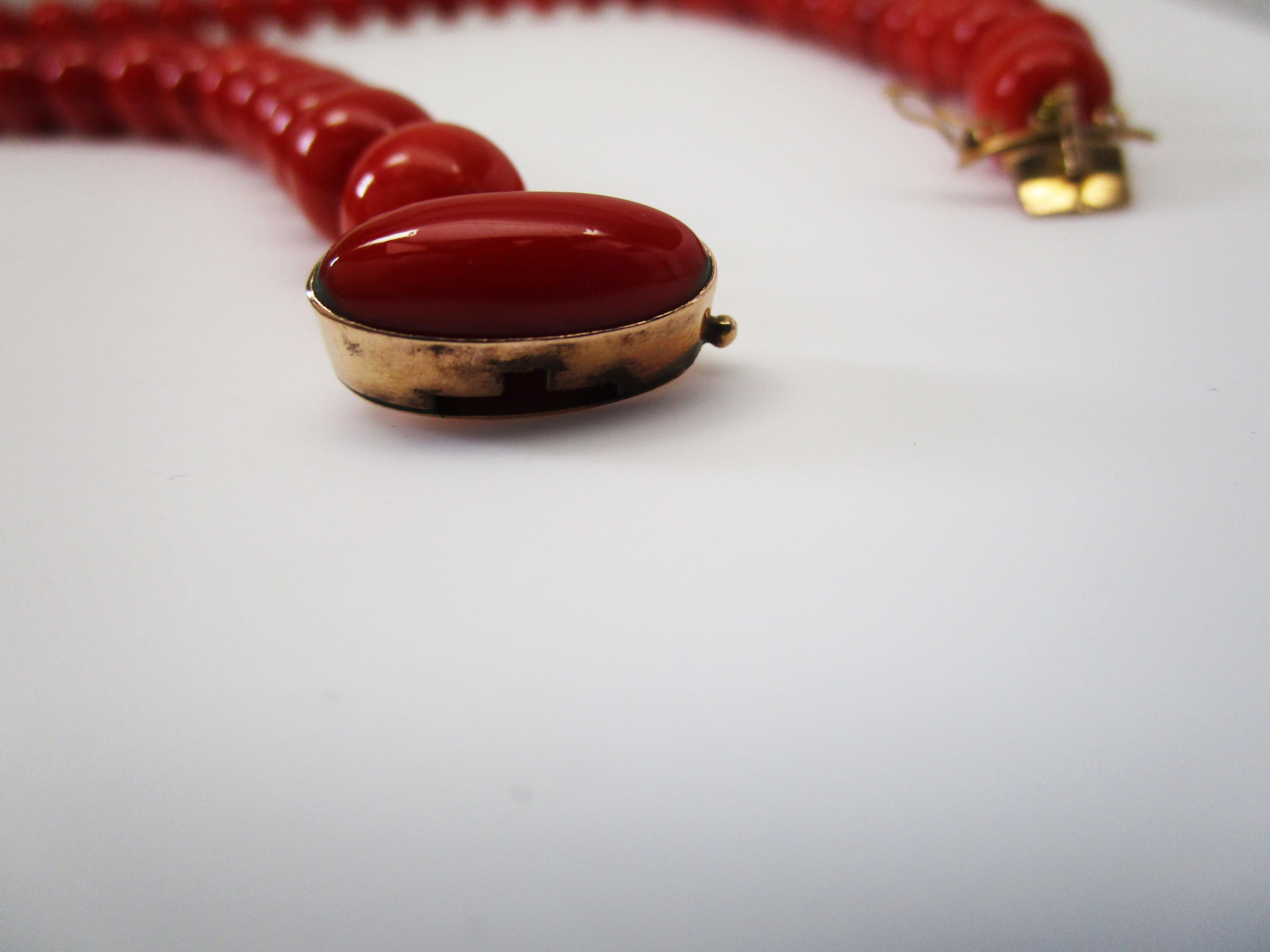 This mid-century undyed natural red coral necklace is in excellent condition and has an American Gem Labs (AGL) report. 

This Mid-Century red coral necklace is a versatile and classic piece!

The beads measure 10 mm wide. Smallest bead is just