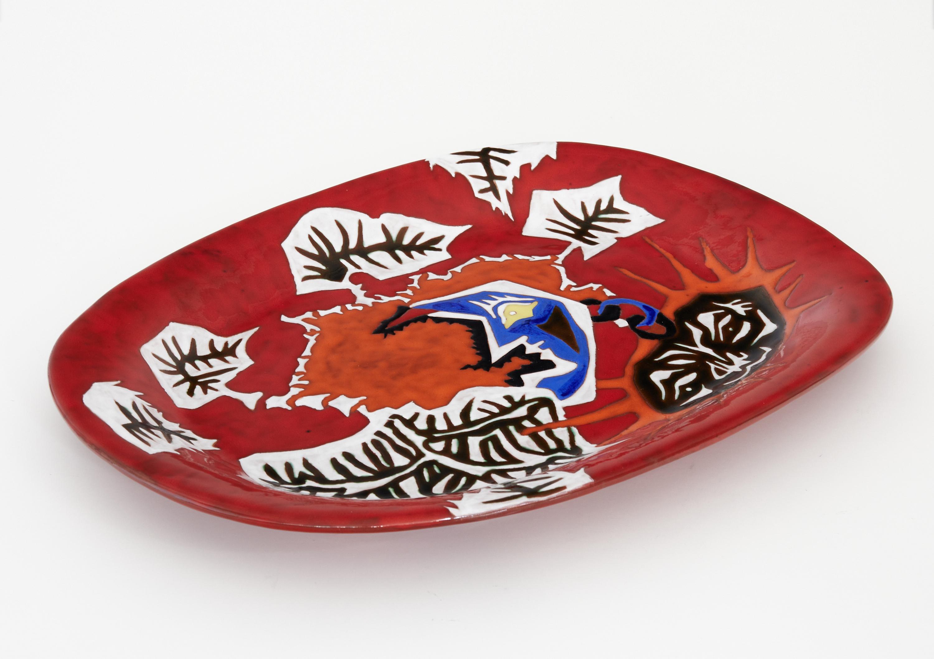 Mid-century red glazed ceramic dish by Jean Lurçat for Sant Vicens marked 1/50.

Jean LURÇAT was a famous French painter and ceramist whose paintings were also transposed on beautiful Aubusson tapestries. 

This rare dish from an edition of 50