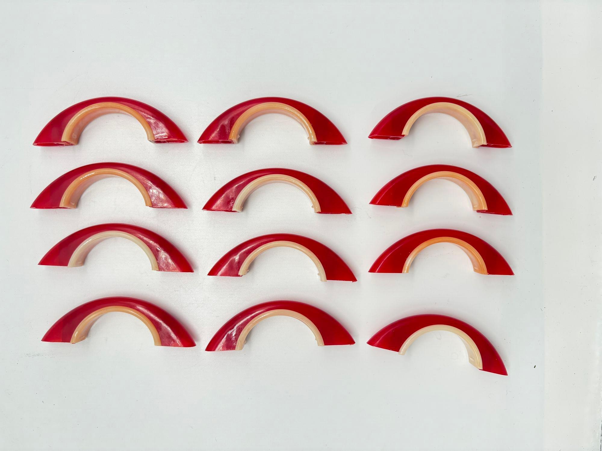 Mid-Century New Dead Stock, has never been used!
This elegant vintage drawer pulls in a stunning candy-red hue with white trim. These are brand new old stock, untouched and pristine, yet possess a charming vintage allure.

Each pull measures 3 1/4
