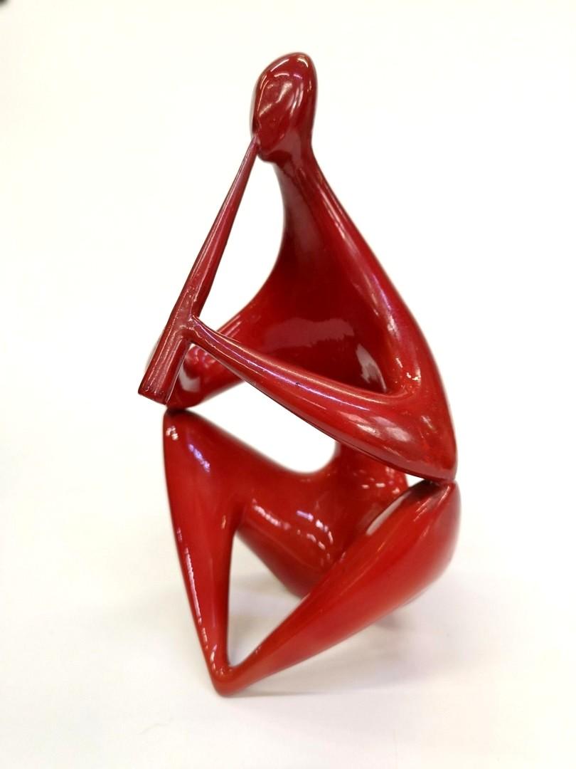 Midcentury red sitting figure porcelain, from Zsolnay designed by Janos Torok, 1960s.