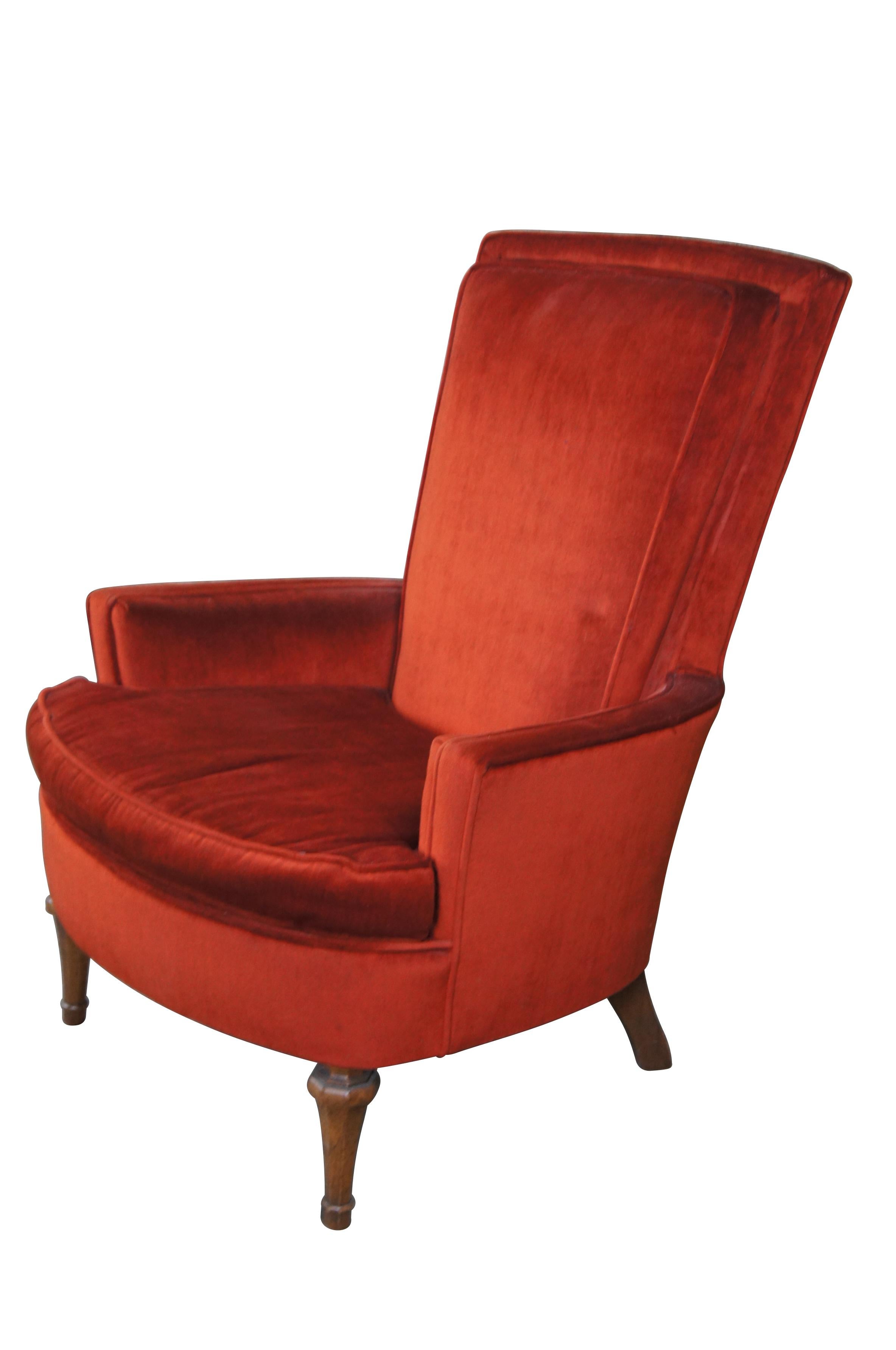 Red velvet highback lounge chair.  Features a high padded back and low arms over distressed walnut turned feet.  

Dimensions:
30.5