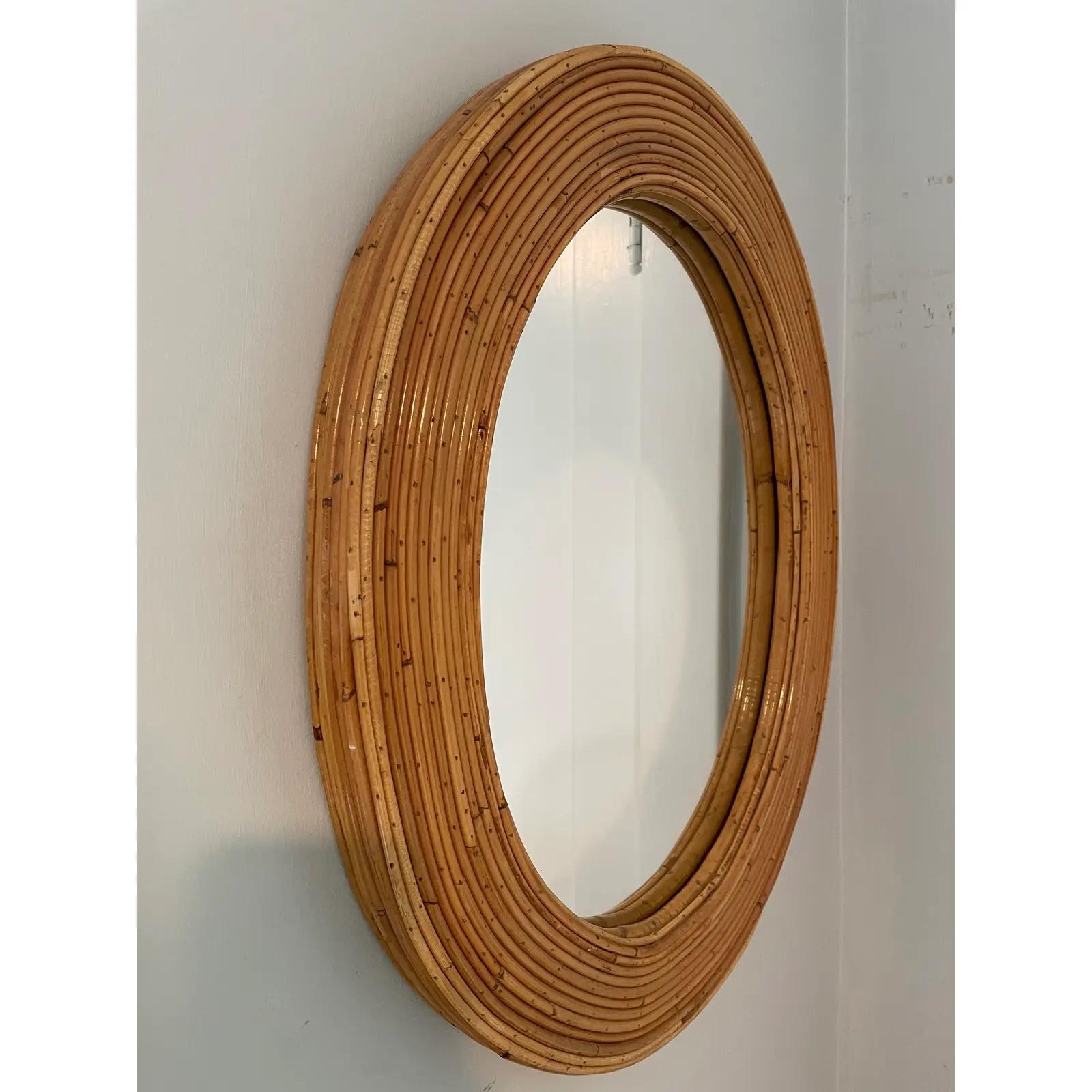 Beautiful simplistic elegance. Versatile styling with this Palm Regency oval Pencil Reed mirror.