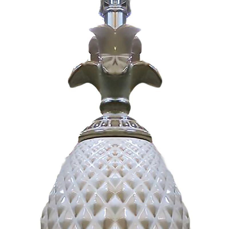 Pair of Late Mid-Century Pineapple lamps crafted in ceramic with a taupe and white finish. The body of the lamp is made of a pineapple shape with a raised pyramid pattern on top of a Greek-style footed column pedestal. These lamps seamlessly blend