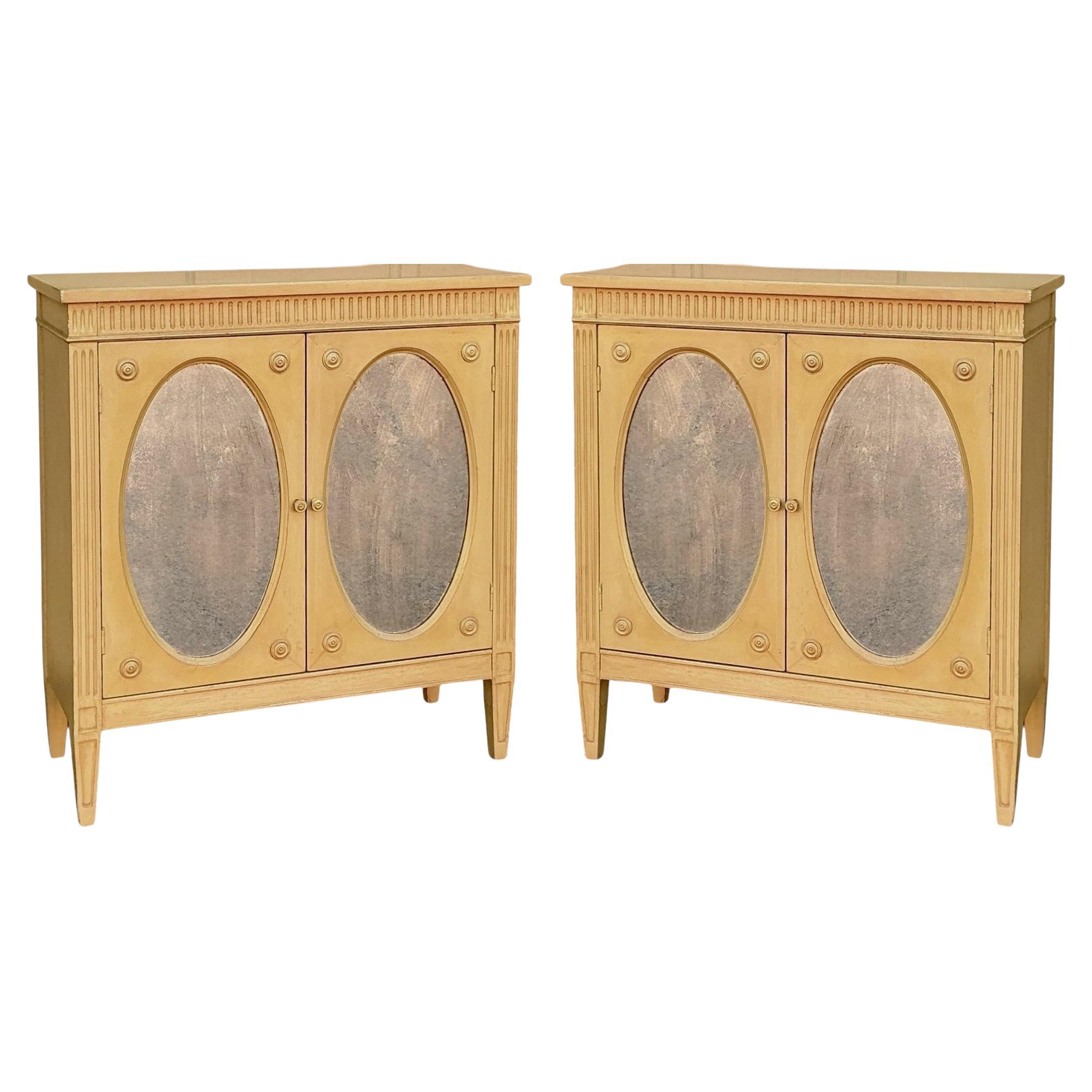 This is a pair of mid-century regency style side cabinets with mirrored inset panels. They open to a single interior shelf. They are a great hard-to-find size. The cabinets are unmarked.

Typical shipping is two to five weeks, but I am having quite