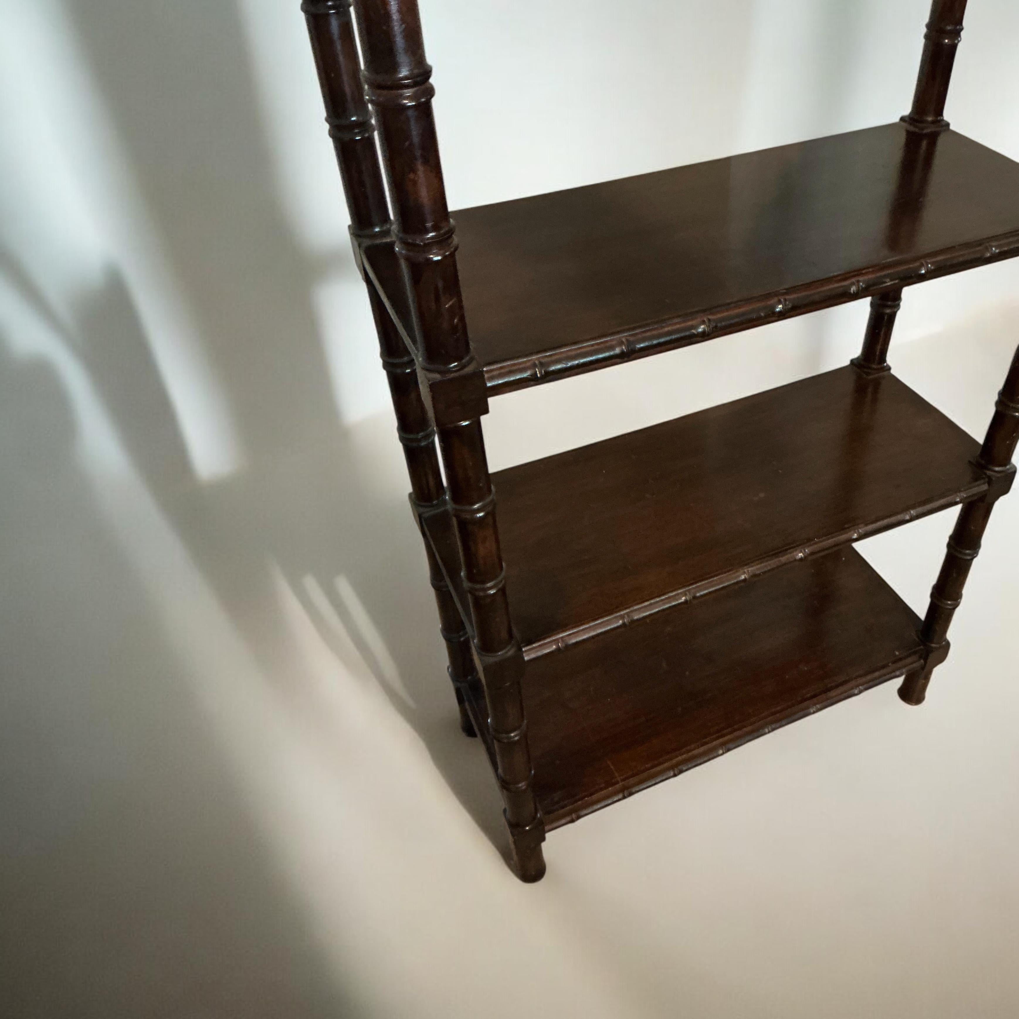 This is a regency style carved fruitwood faux bamboo shelf / etagere / bookcase. The shelves are about 11.75” deep, and 14 inches in height. The top shelf is the only one that has a little more height because of the arch and its empty space. The