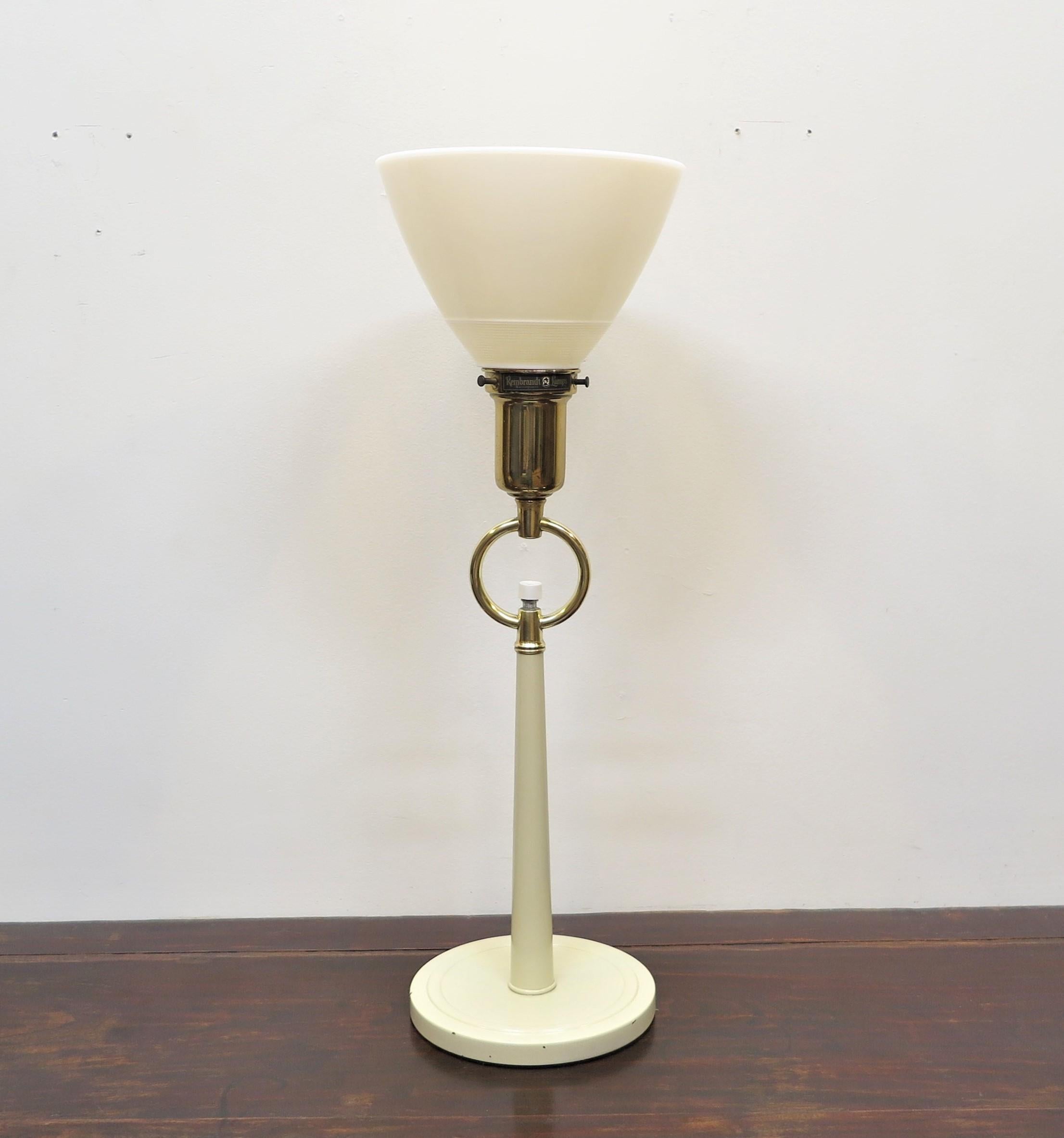 Early Mid century Rembrandt torchiere table lamp. Hollywood Regency style brass ring with switch knob in the middle having milk glass shade. Stunning table lamp providing excellent lighting.  Can also be used with a regular shade that rest on the