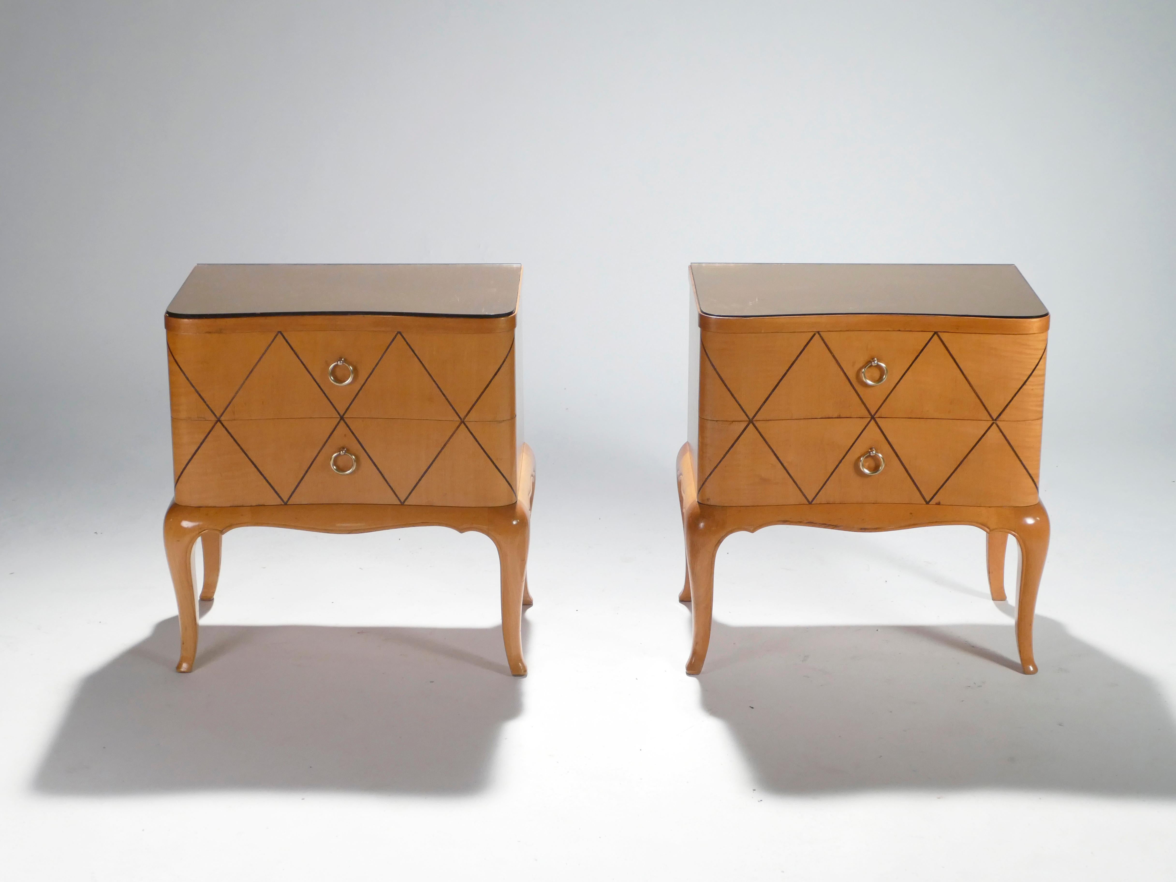 These Art Deco nightstands or side tables infuse a cozy, romantic feel into a contemporary bedroom. With a base of warm sycamore maple and a stunning mirrored bronze top, the pair is typical of twentieth century designer Rene Prou’s modernist work.