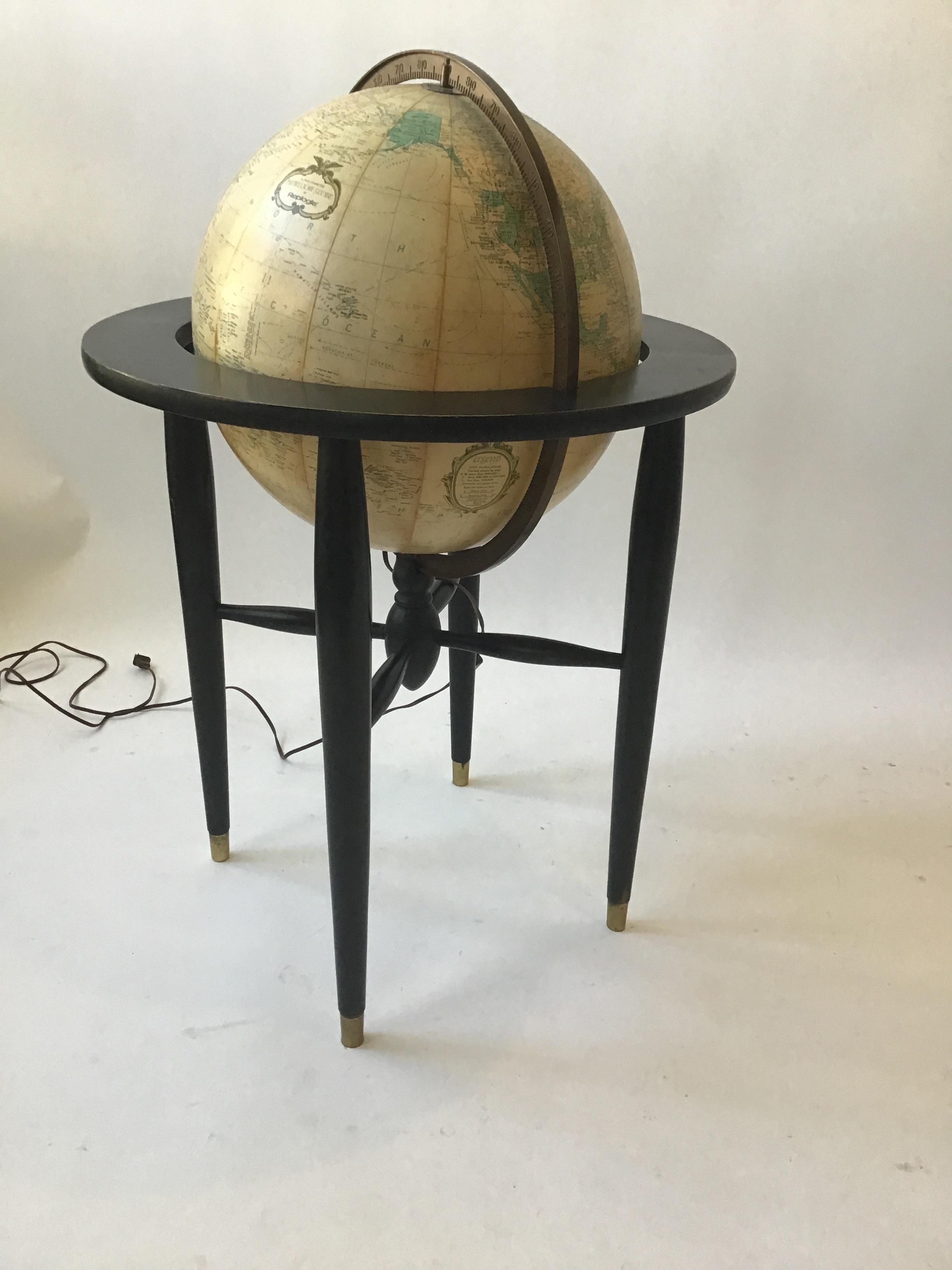 1950s 16 inch diameter heirloom globe by Replogle. Wood frame, brass accents.
Globe lights up, once rewired. It currently does not.
