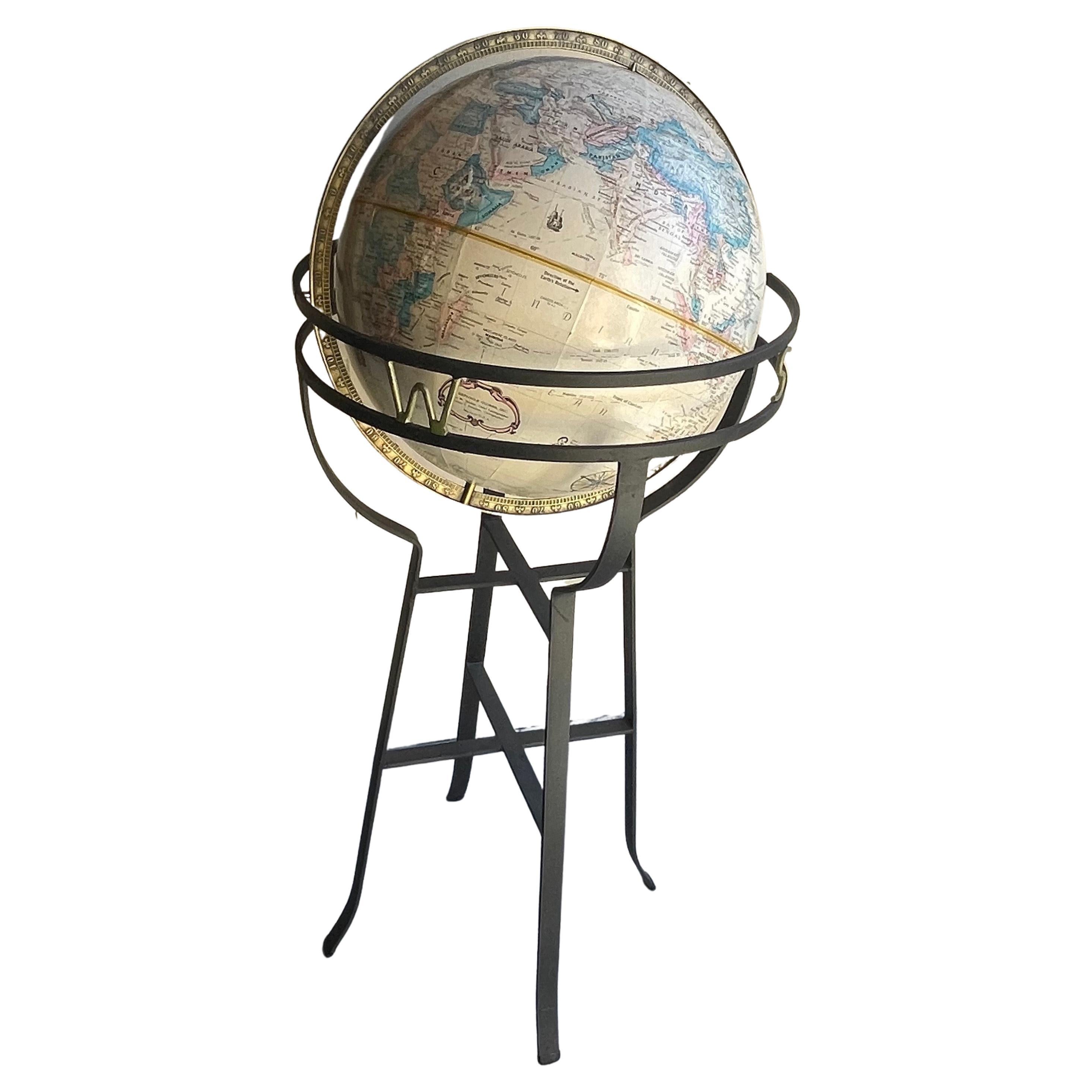 Globe rptitif du milieu du sicle sur socle en fer forg  la manire de Paul McCobb