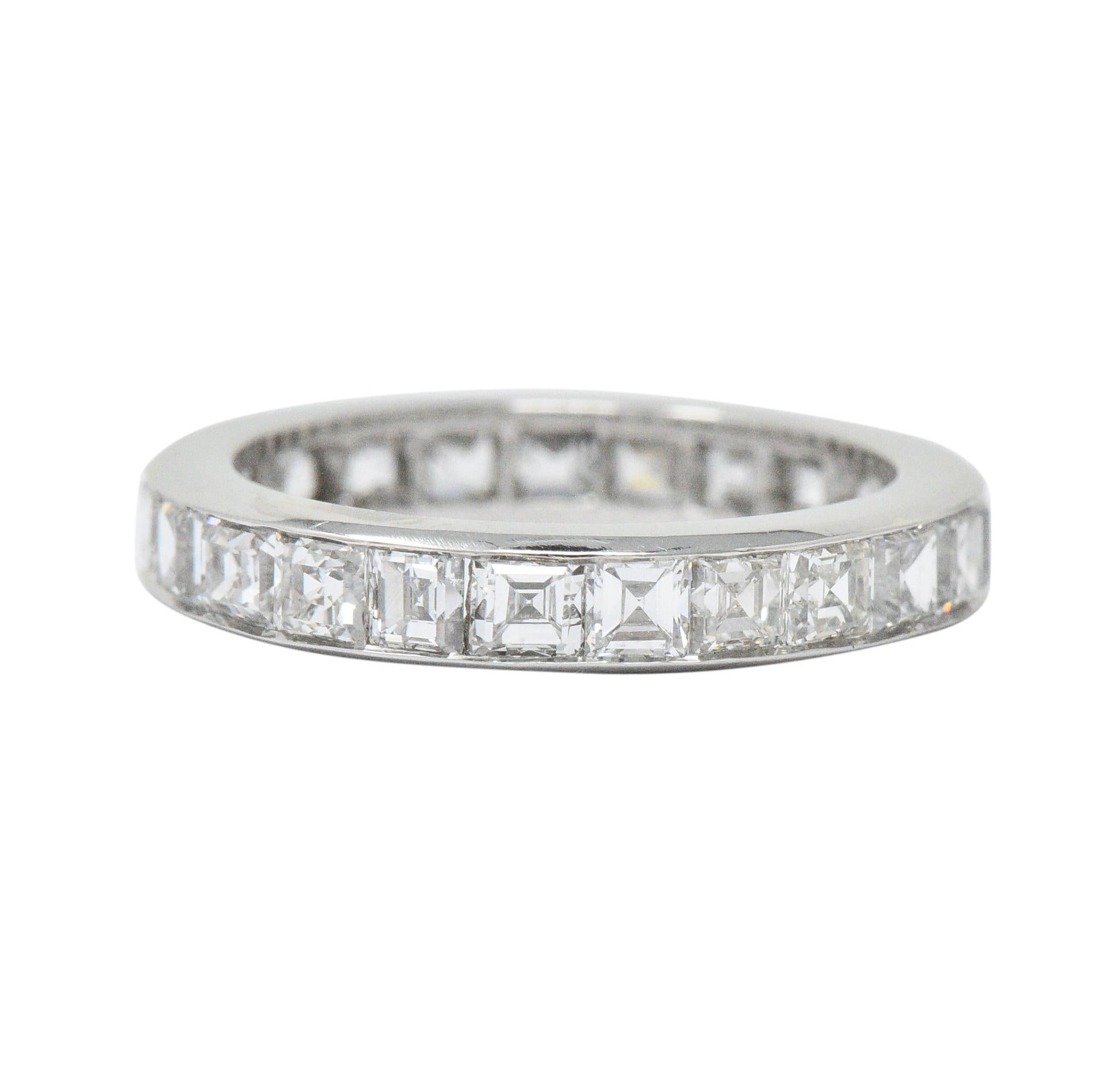 Eternity style band channel set fully around by twenty-three assher cut diamonds

Total diamond weight is approximately 4.14 carats with G/H color and VS to SI clarity

Completed by sleekly polished channel walls

Tested as platinum

Circa: