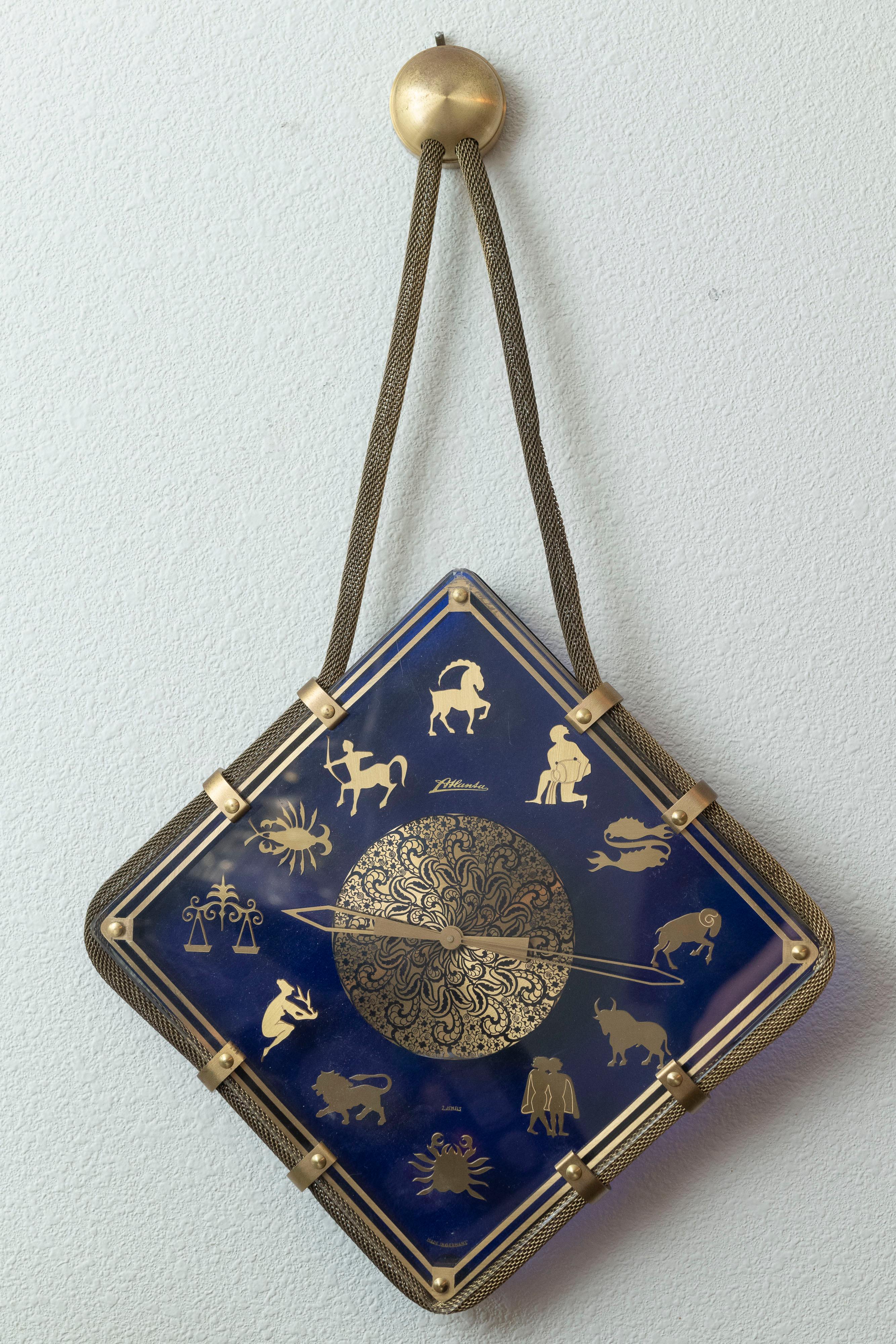 This quite unusual clock while displaying the signs of the Zodiac calendar, certainly is not for just astrology aficionados. The clock is signed on the dial 