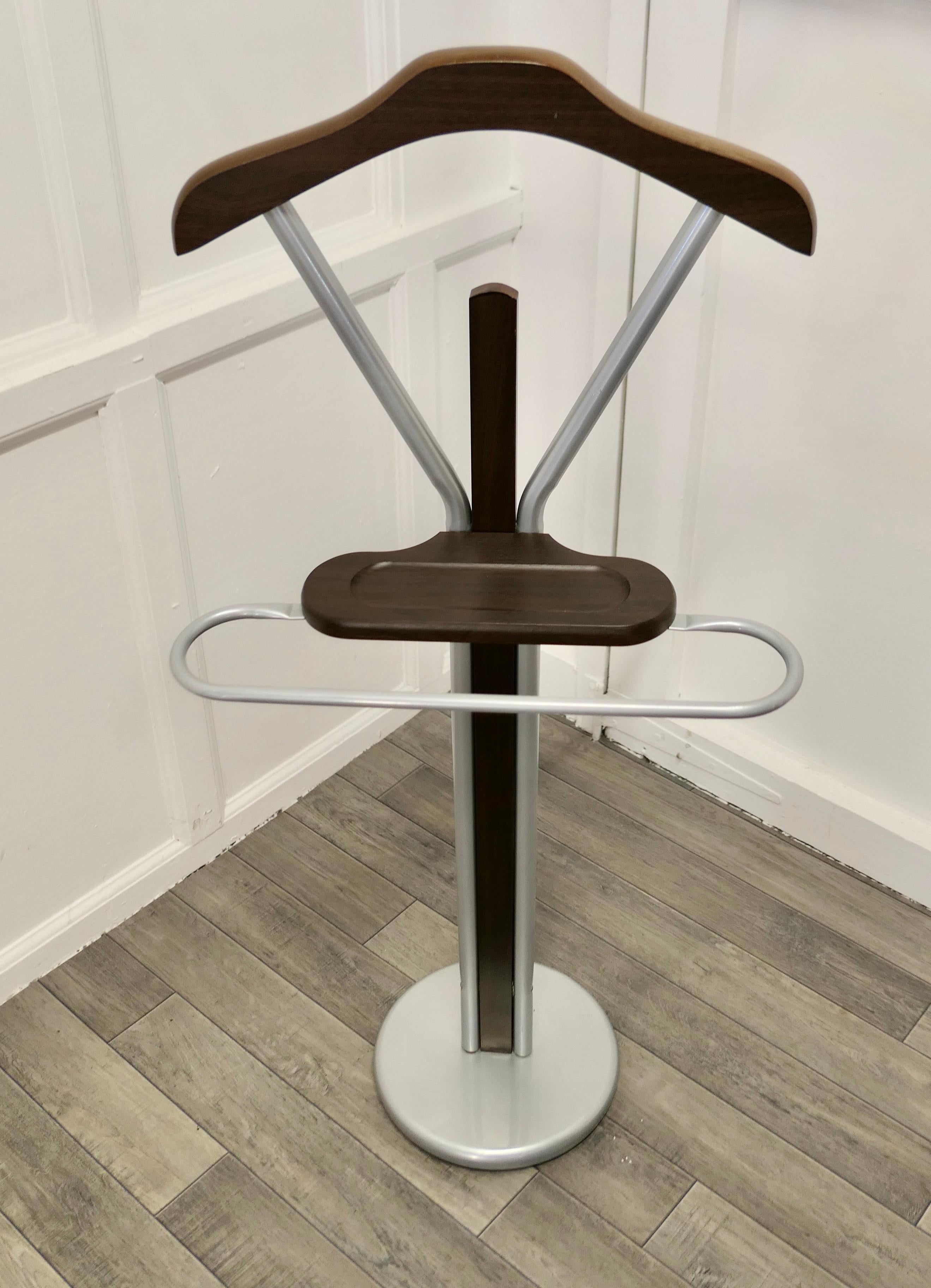 Mid Century Retro chic gentleman’s floor standing suit hanger or dumb valet.


A very useful piece, the Valet or clothes stand has a modern look in brushed aluminium with simulated wood coat hanger and shelf with an aluminium trouser rail
This