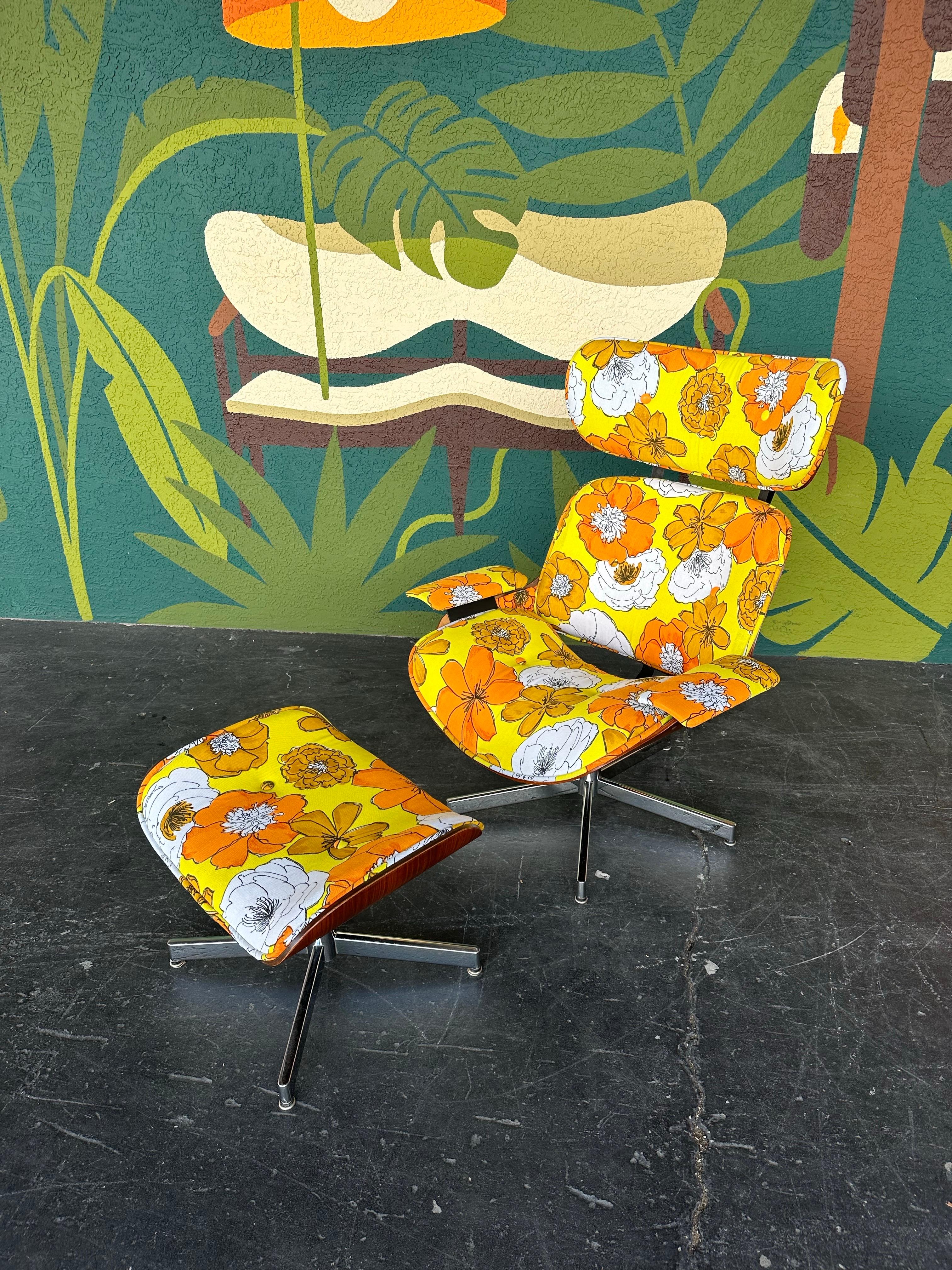 Mid Century Modern Eames Style Lounge Chair and ottoman set by Plycraft c.1960’s. Previously reupholstered (within past few years) in new old stock groovy yellow, orange and white floral fabric. Walnut bentwood shell with shiny chrome swivel base on