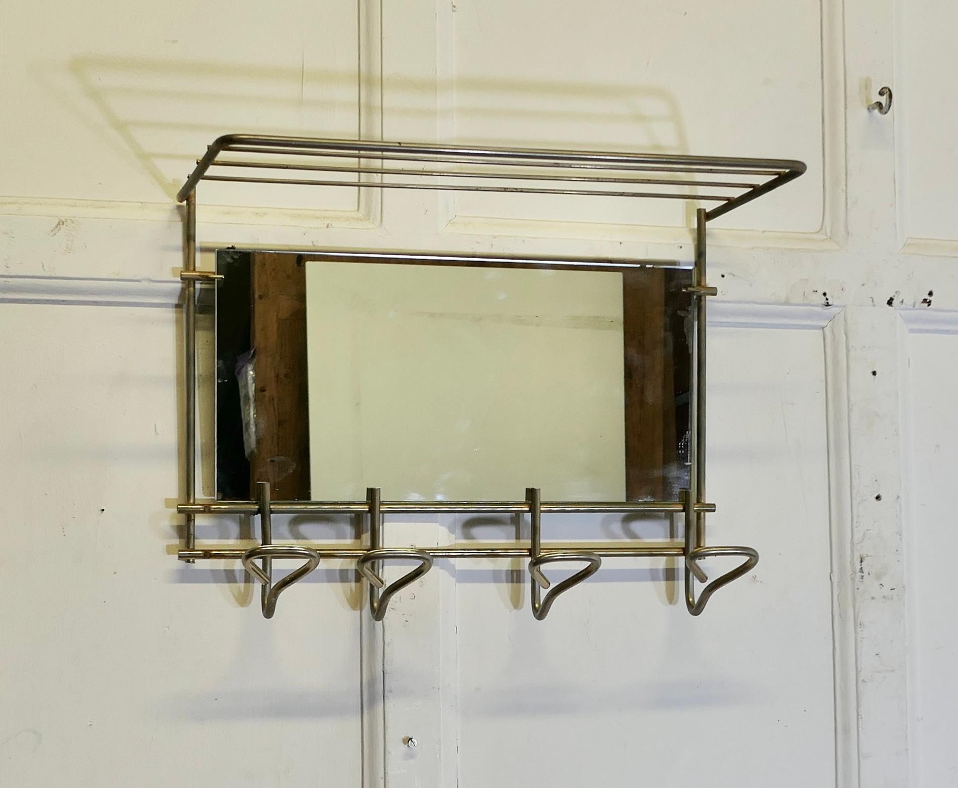 Mid Century Retro Polished Steel Mirrored Hat and Coat Rack

 This is a very stylish piece, the steel frame has a railed shelf with 4 hooks, and a good size mirror

A very useful piece for a cloakroom or hall 

The rack is in good condition, it is
