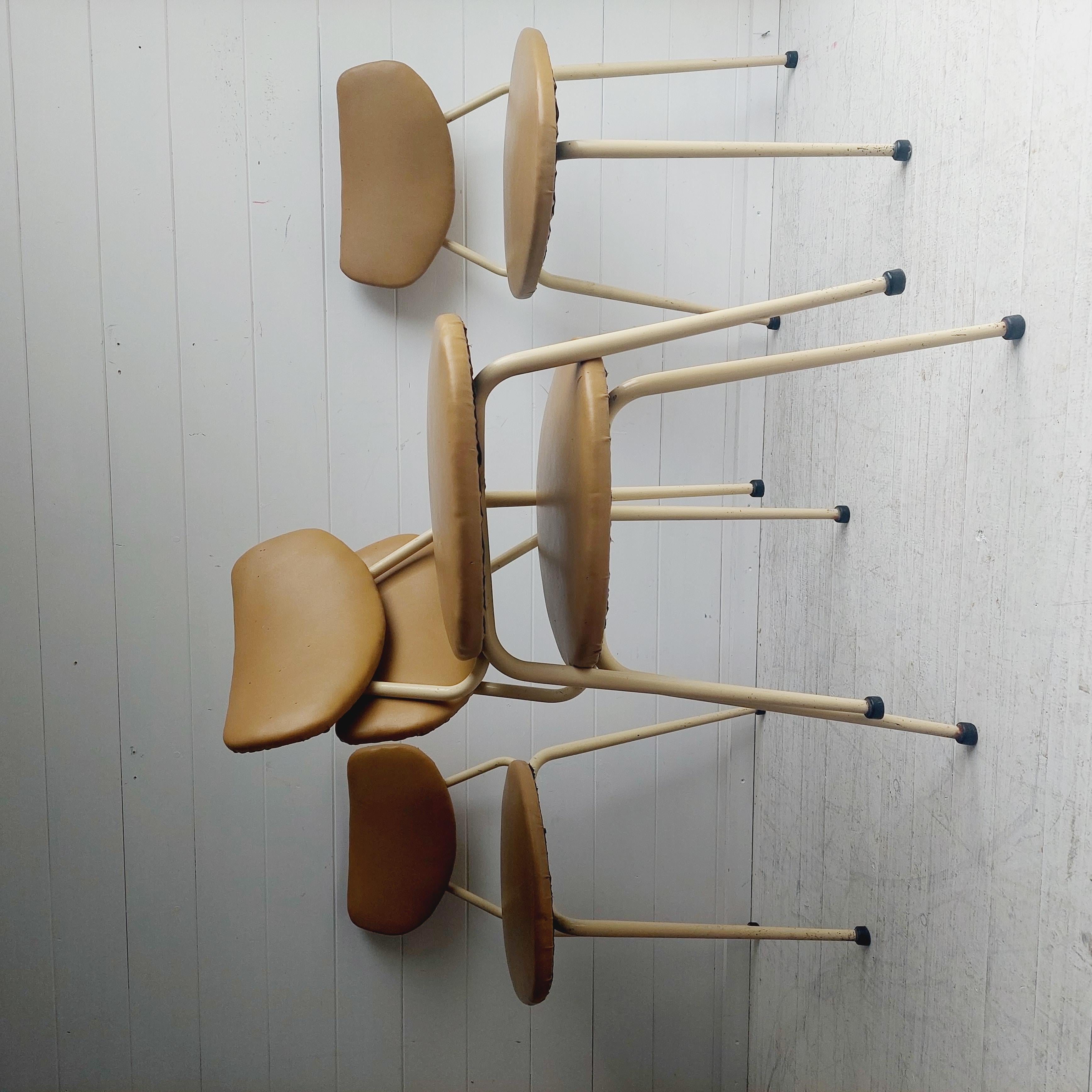Set of 4 very retro and unique dining chairs.
 
Metal mid century tubular stacking chairs. 
Vinyl seats and backs. 
Original paint still intact. 
Very super cool vintage chairs.
These chairs were made in England by Rel

Based on the Dot stool