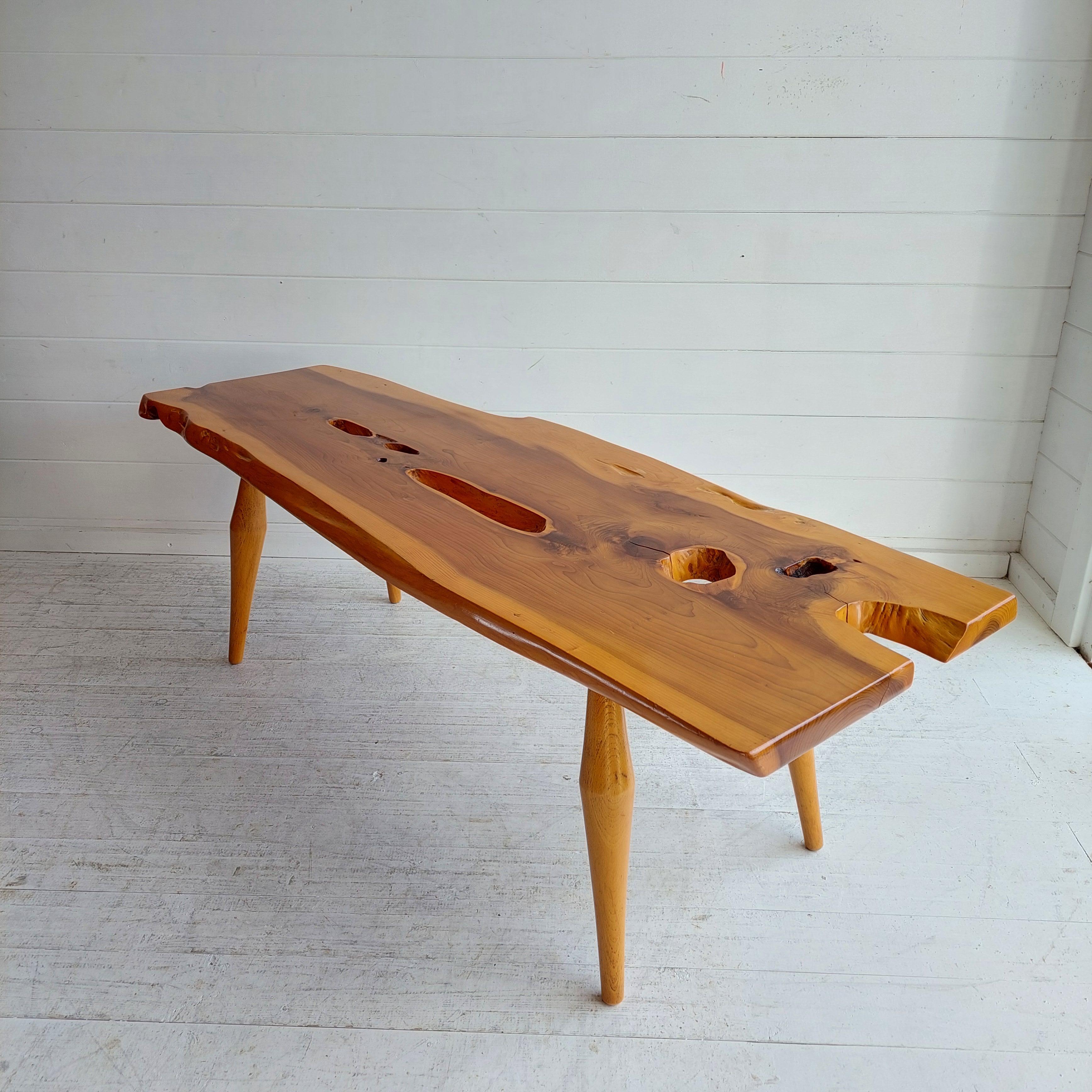 Mid Century live edge organic yew wood coffee table 
Most probably by Reynolds of Ludlow, 1970s
There is no makers mark present but it is reminiscent of Reynolds of Ludlow.

The solid yew top is gorgeous with impressive contrasting colours and a