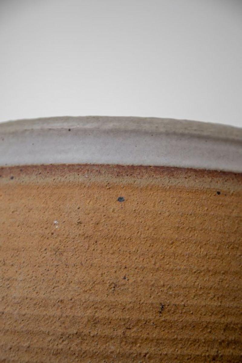The mid century ribbed stoneware pot is hand-thrown with precision and care by the skilled artisan bob kinzie. Every planter is a unique work of art, showcasing the expertise and attention to detail of its maker.

Crafted from high-quality