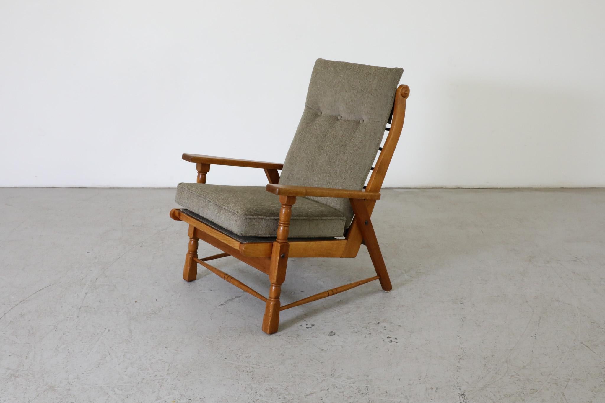 Mid-Century Dutch lounge chair in the style of Robert Parry. An attractive decoratively oak frame lounge chair with new sage toned upholstered seat and back cushions. Well-built and in overall original condition with wear consistent with its age and