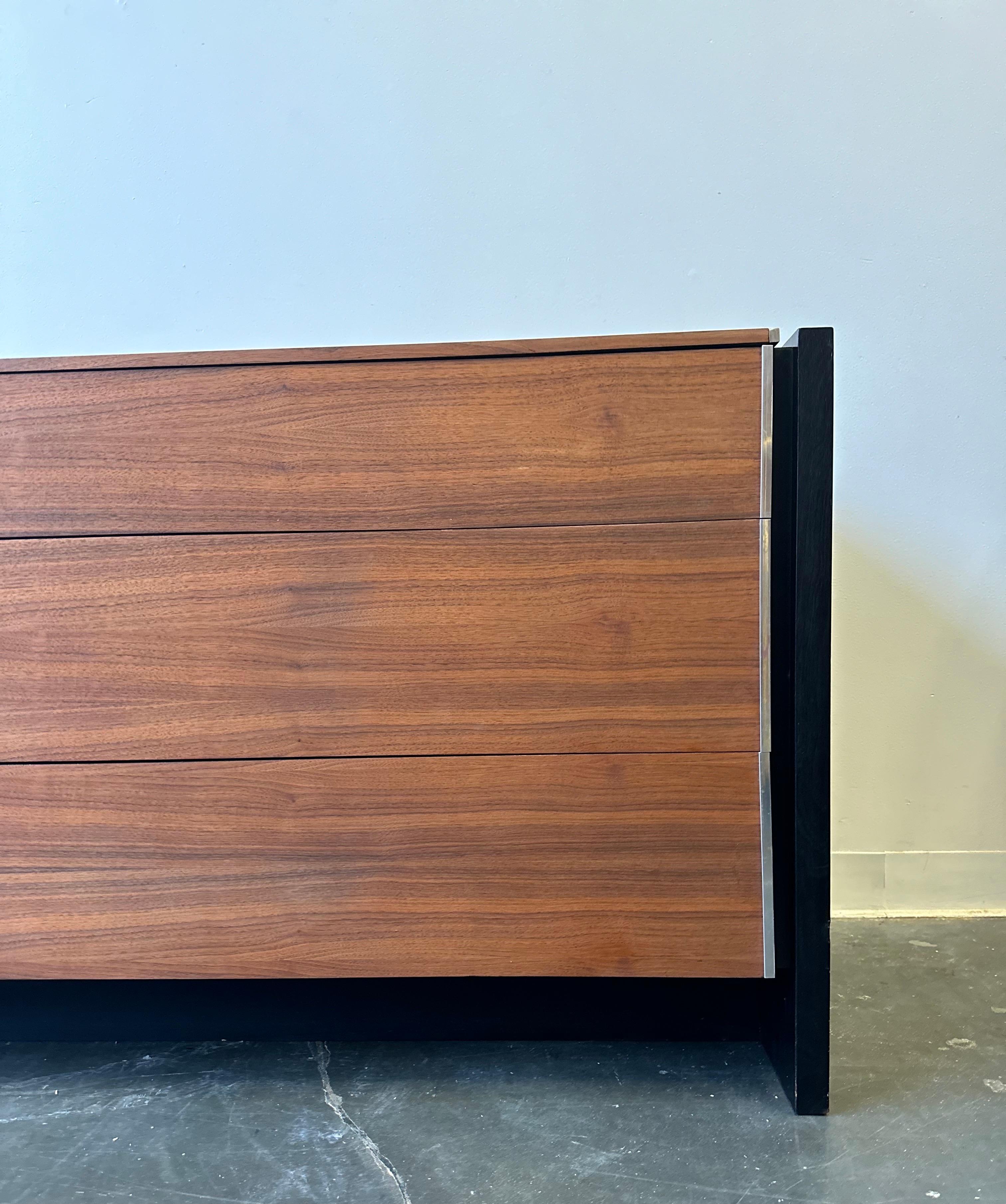 ROBERT BARON GLENN of CALIFORNIA Walnut Credenza Sideboard Dresser. Ebonized oak panel sides. Recessed black platform base. Stainless trim.

The walnut has been refinished and the black touched up.  This is in fantastic condition.

Dimensions: H: