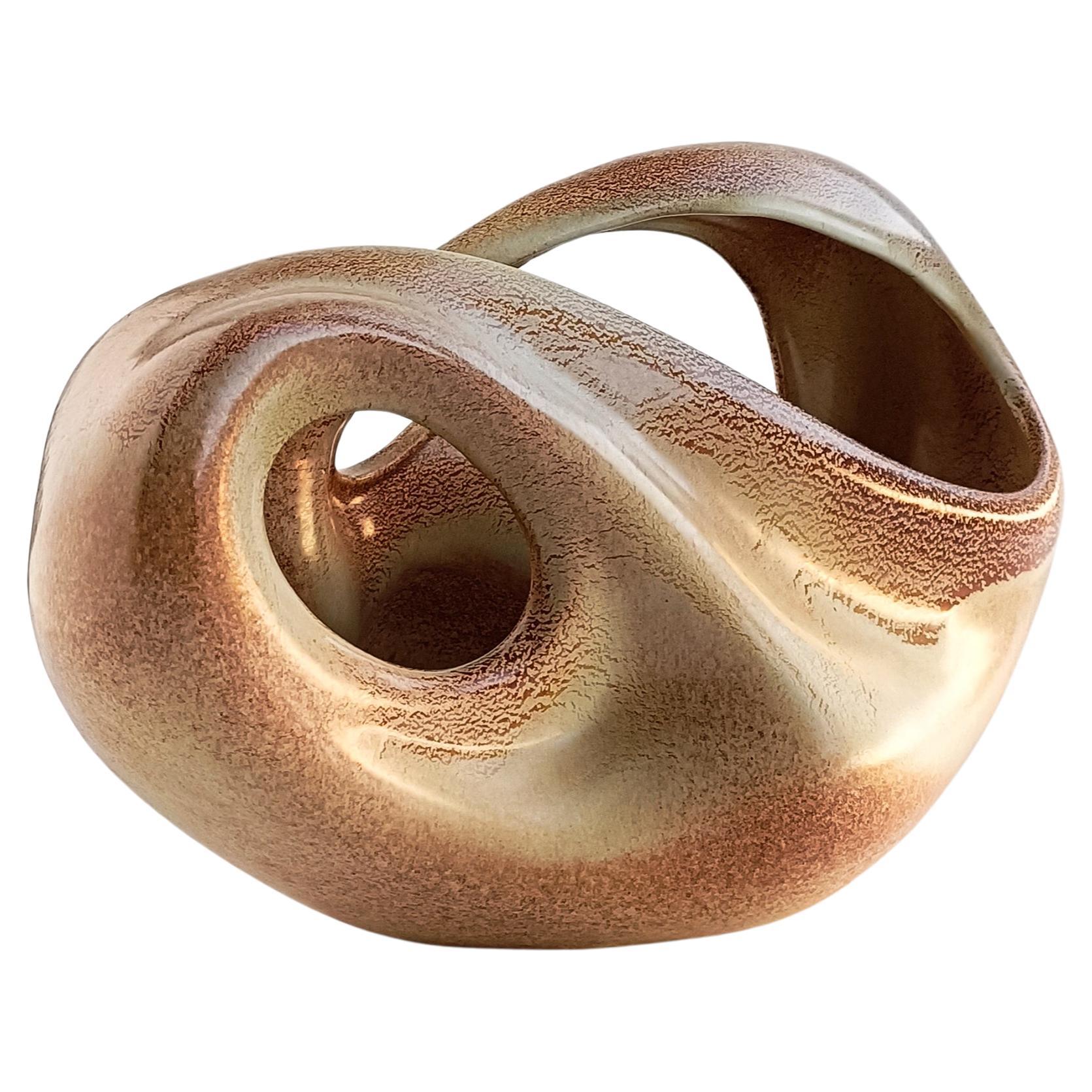 This Bertoncello sculptural ceramic vase from Italy, dating back to the 1960s, is a remarkable piece of Italian ceramic artistry. Roberto Rigon was a notable designer associated with Bertoncello, a renowned ceramics manufacturer based in Italy