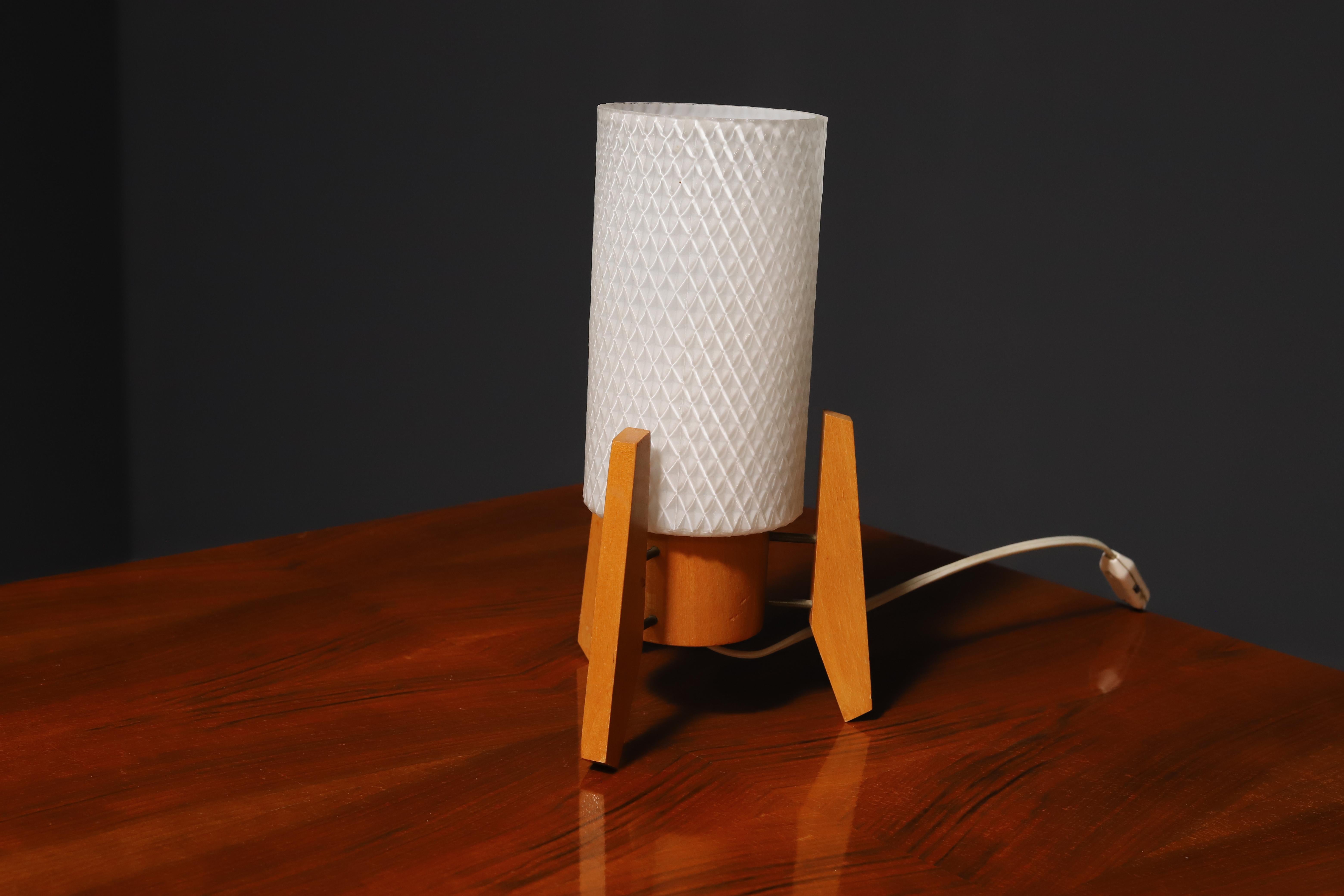 Mid century desk lamp, associated with “Brussels period” and world-renowned EXPO58. It was made in Dřevo Humpolec company in the former Czechoslovakia in the 1960´s. Material: wood, milky glass.

Overall, it is in good Vintage condition, fully