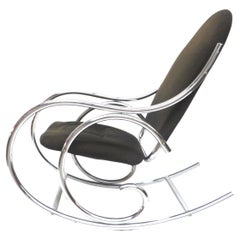 Retro Mid century rocking chair with solid chrome frame and fabric seat from the 70s