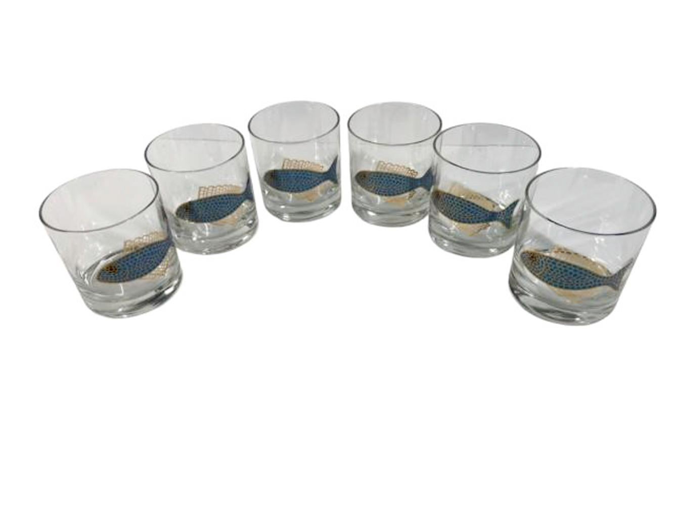 Set of six rocks glasses by Couroc of Monterey - each with a fish in translucent blue enamels with 22k gold detail creating a mosaic effect.