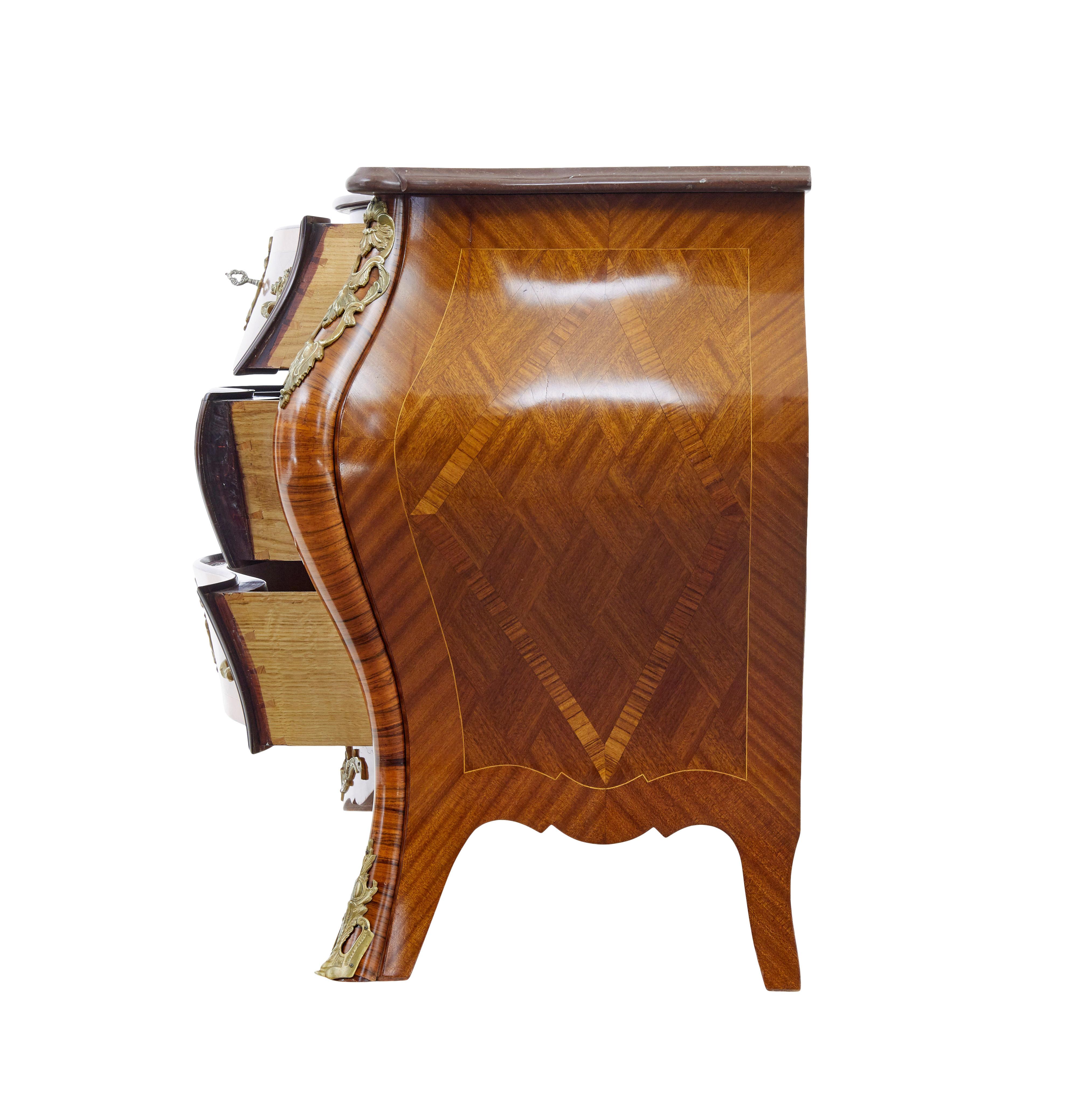 Mid century rococo revival fossil marble bombe commode circa 1960.

Excellent quality commode by A.B rococo mobler. Beautifully bombe shaped marble top commode.

Veneered using mahogany, walnut, satinwood and kingwood. Decorated with rocaille and