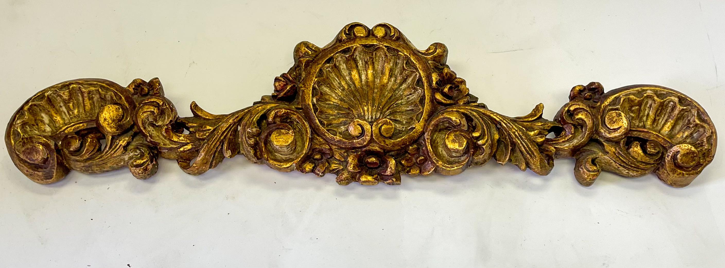 This is a pair of mid-century Rococo style carved giltwood Spanish valances or wall plaques. They are marked and in very good condition.