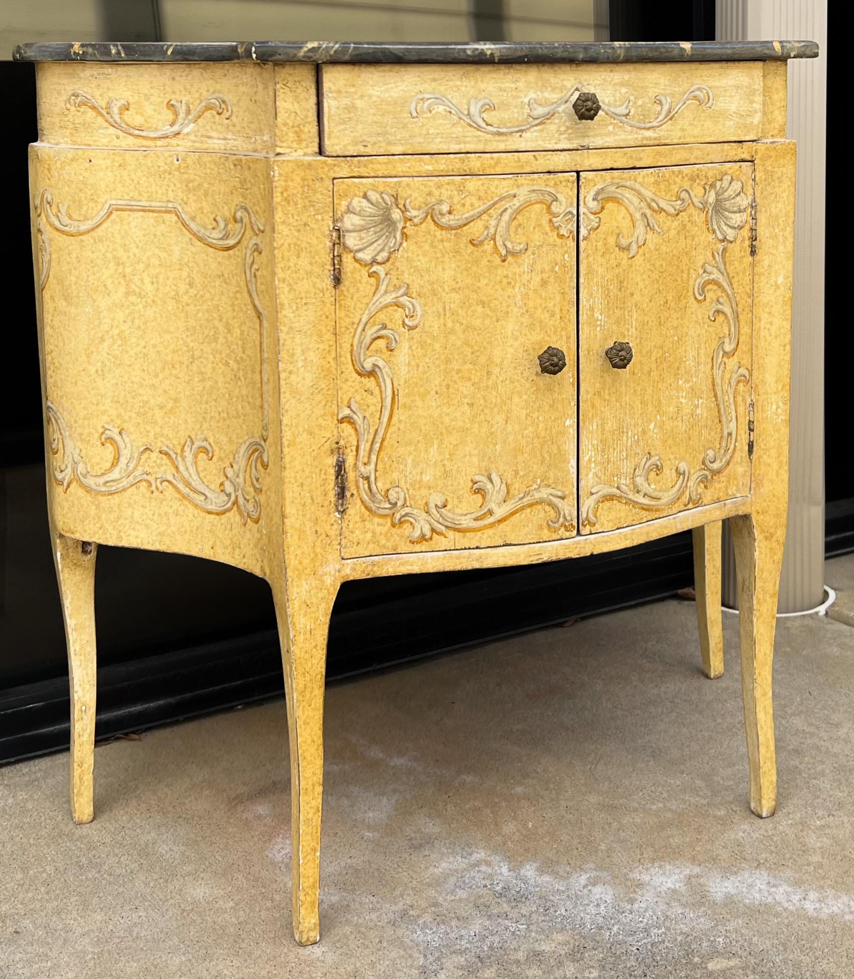 Fantastic hand painted Italian chests! The tops are faux marbleized. They also have the original label, and a serpentine form. The cabinets are a single drawer over two doors. They are in very good condition.