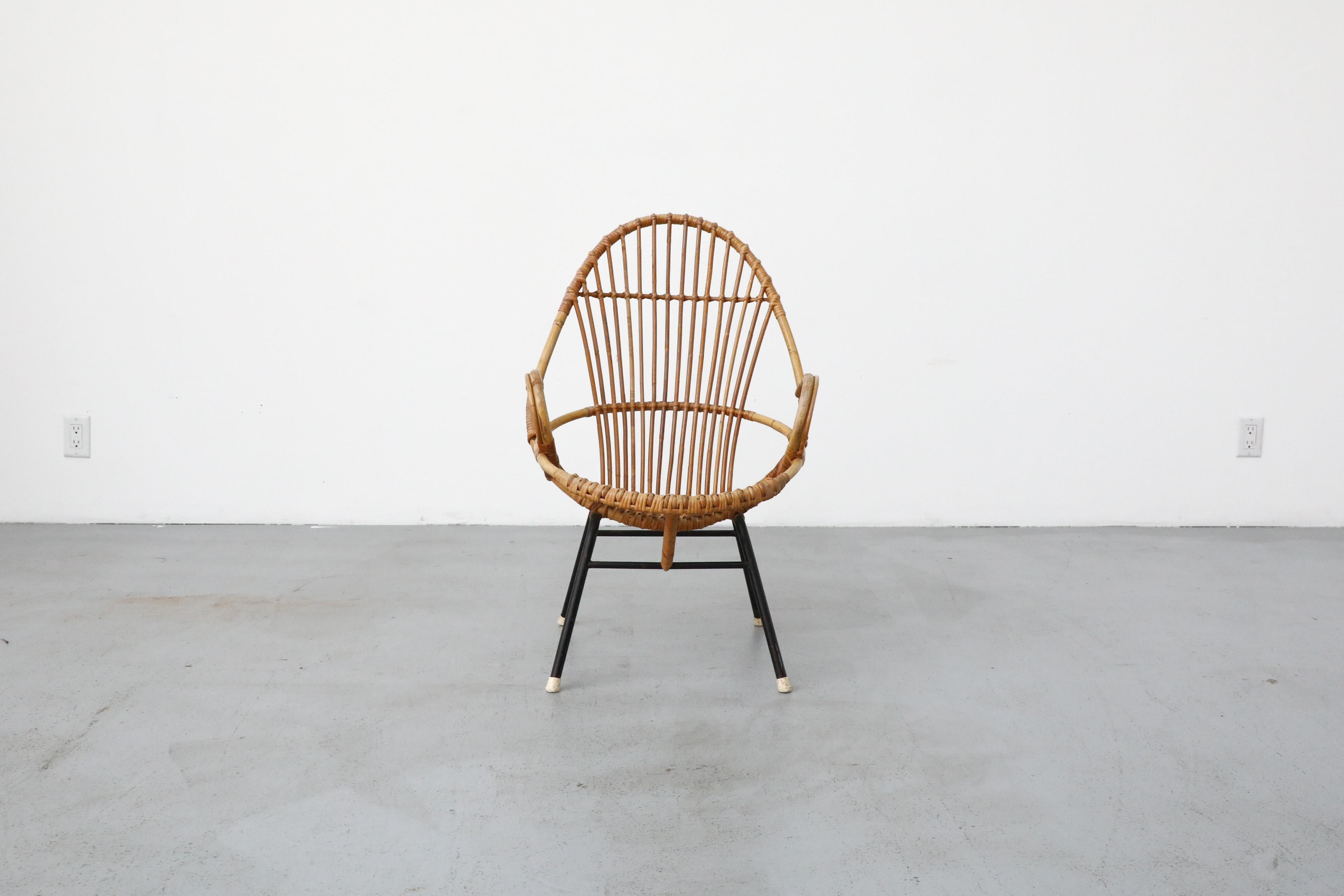 Sweet little Rohe Noordwolde bent bamboo armchair with black enameled legs and white foot caps. In original condition with visible wear consistent with age and use. Other similar styles available, listed separately.