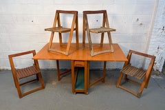 Tavolo a ribalta rumeno di metà secolo con quattro sedie Foldes