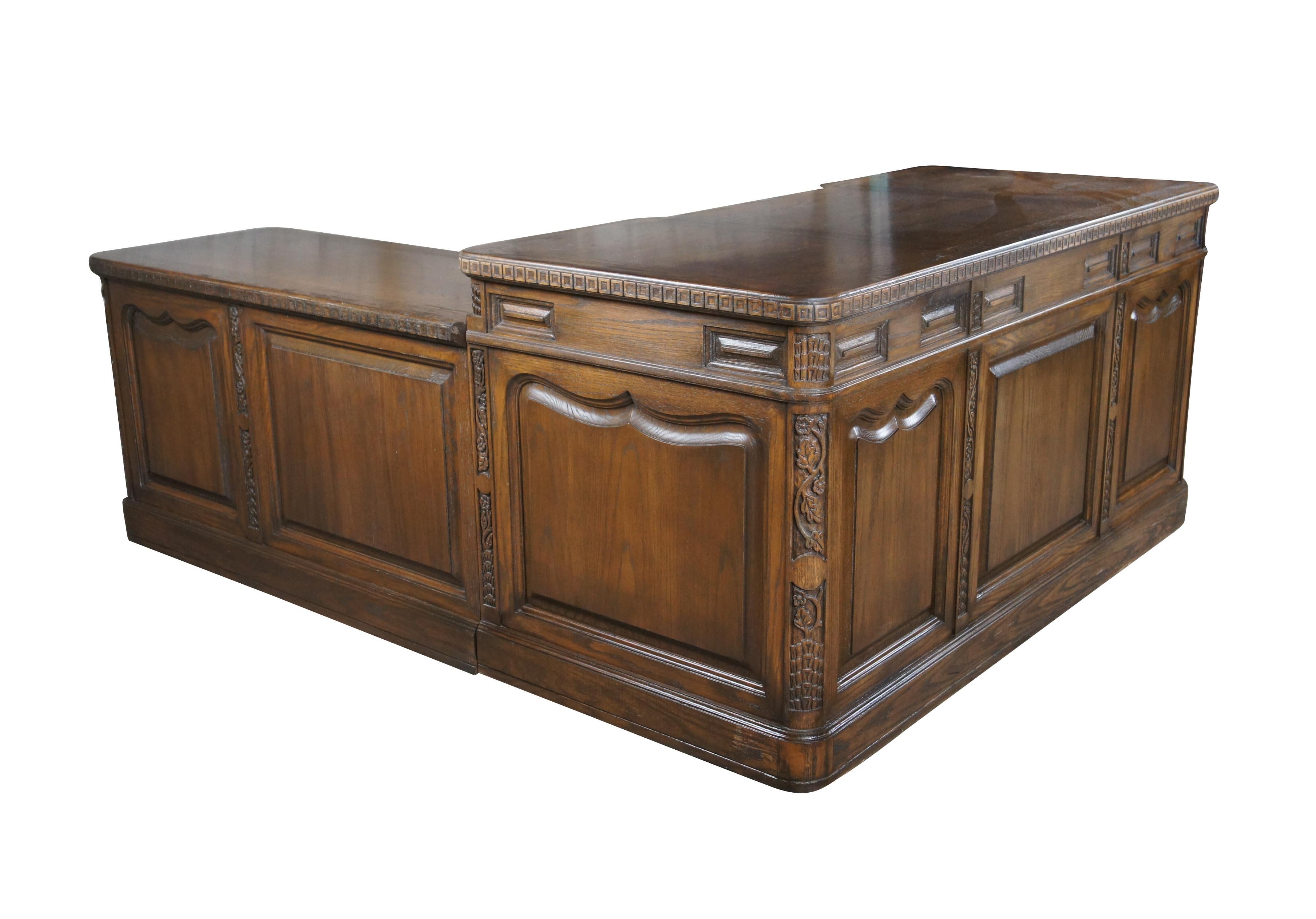 Romweber (R-10962) secretary's Desk (Right Hand), circa 1974. Features an L shaped carved oak frame with shapely Nordic inspired moldings, grapevine motif, tooled pillars and floral embellishments.   Features six dovetailed drawers.  Bottom drawer