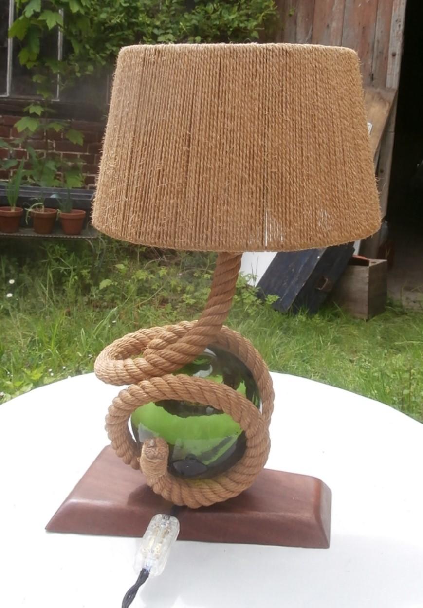 Mid-century rope lamp by Audoux Minet.
With a green glass 
Measures / Height : 18.5 inches.
Wood base / 10.5