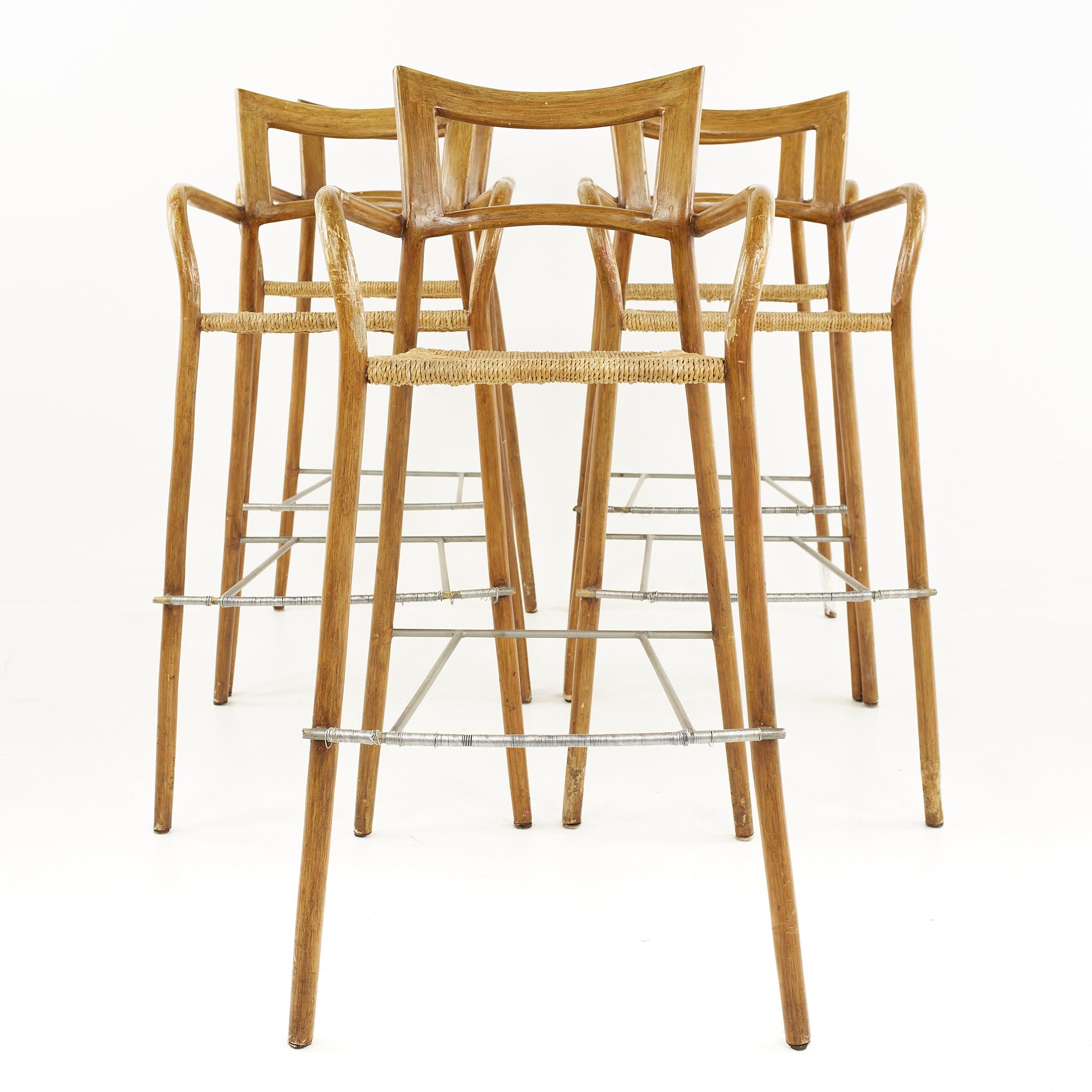 Mid-century rope seat bar stools - set of 5

Each stool measures: 21 wide x 26 deep x 44.25 high, with a seat height of 30.5 inches and arm height of 38 inches

All pieces of furniture can be had in what we call restored vintage condition. That