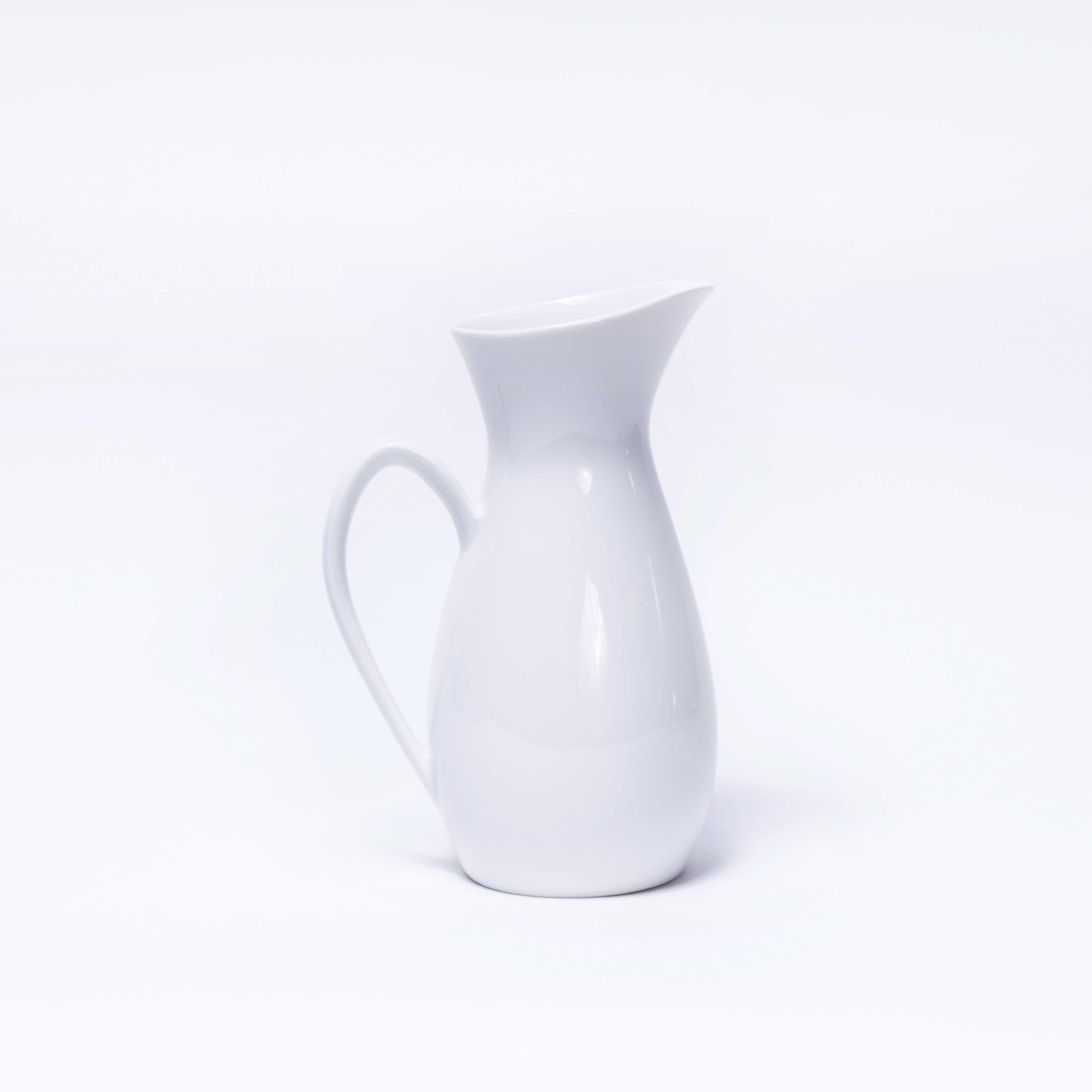 Mid Century Rorstrand White Ceramic Blanca Jug. 

Elegant ceramic jug by the Swedish ceramicist Rorstrand. This is in excellent condition, no chips, cracks or faults.

Workshop Report:
Delicate handmade product do not machine wash or subject to