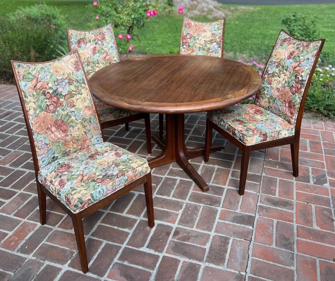 Mid Century Rose Wood Dinning Tale with Eight Chairs By Glen Of California. Wonderful Wooden table with three extra leaves that expand this table up to 107 inches in width. Beautiful Rose wood with spectacular grain. The chairs have been