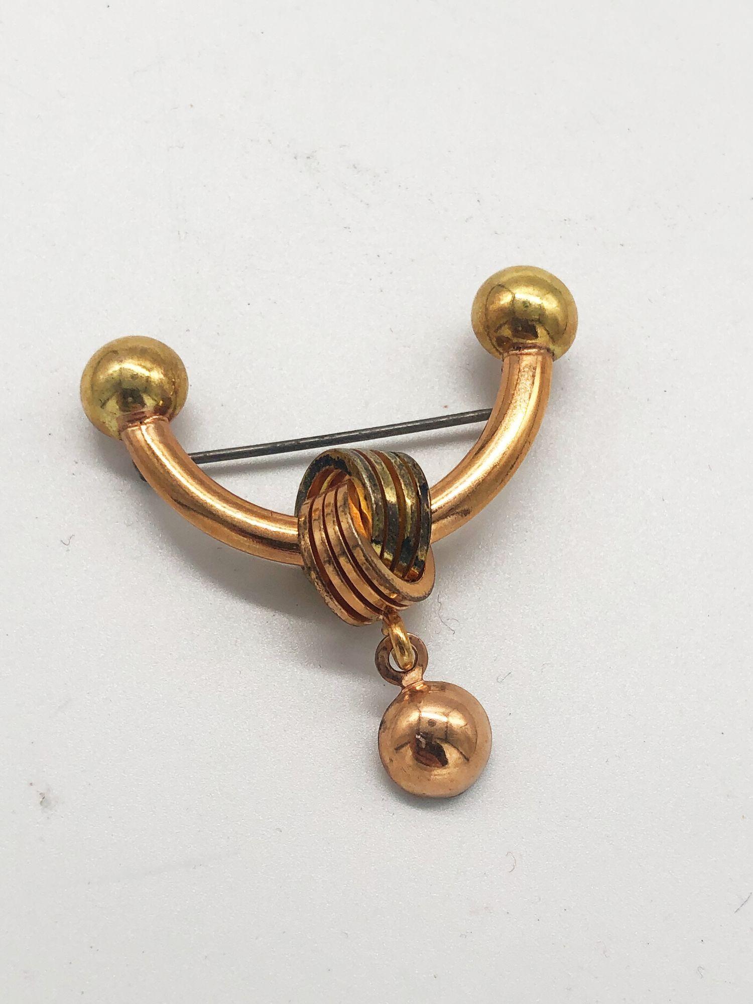 Never used set of three midcentury rosegold plated brooch pins, untouched and vintage. These elegant accessories exude timeless charm and sophistication. A rare find for collectors or those seeking classic, unused adornments with a touch of