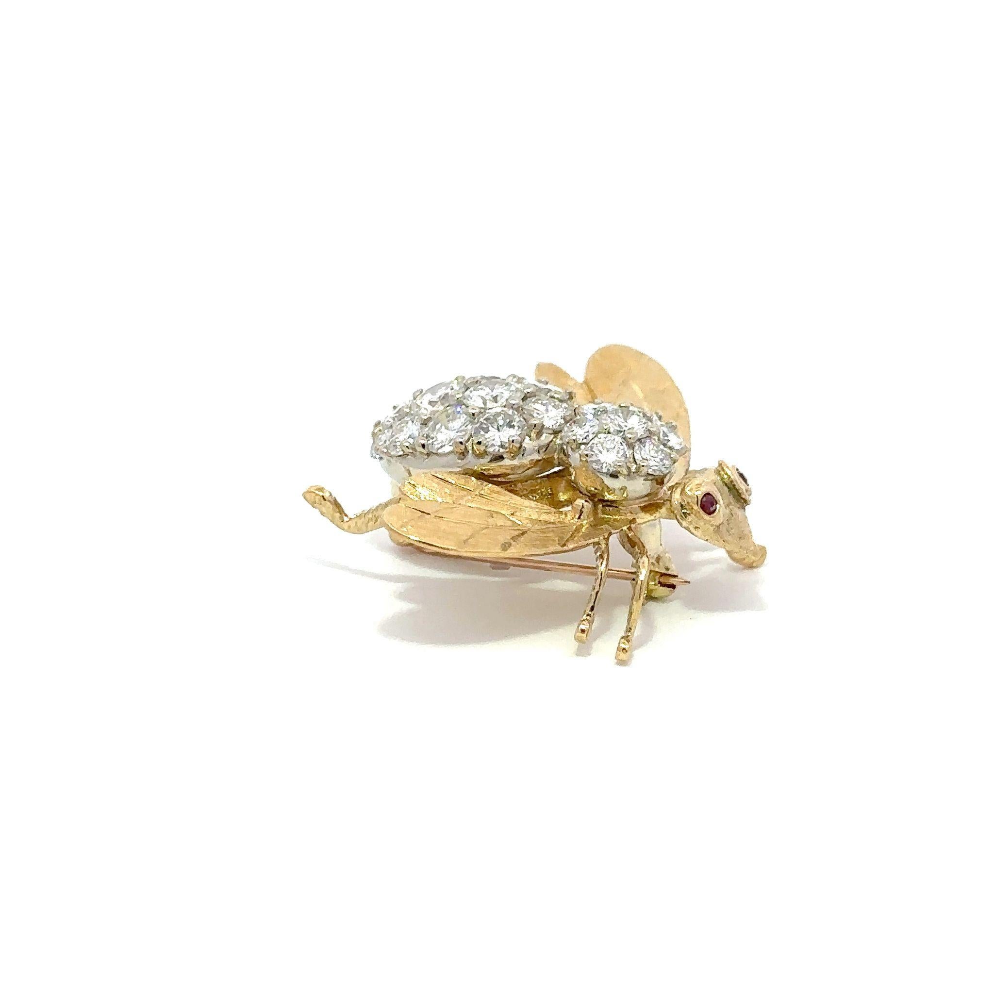 A Mid-Century Rosenthal 18K yellow gold oversized bee pin with a prong-set diamond body and ruby eyes. Circa 1960. 

The bee contains 19 round brilliant-cut diamonds totaling 4.50 carats, G-H color, VS1-SI2 clarity. The brooch measures 1 1/4 inches