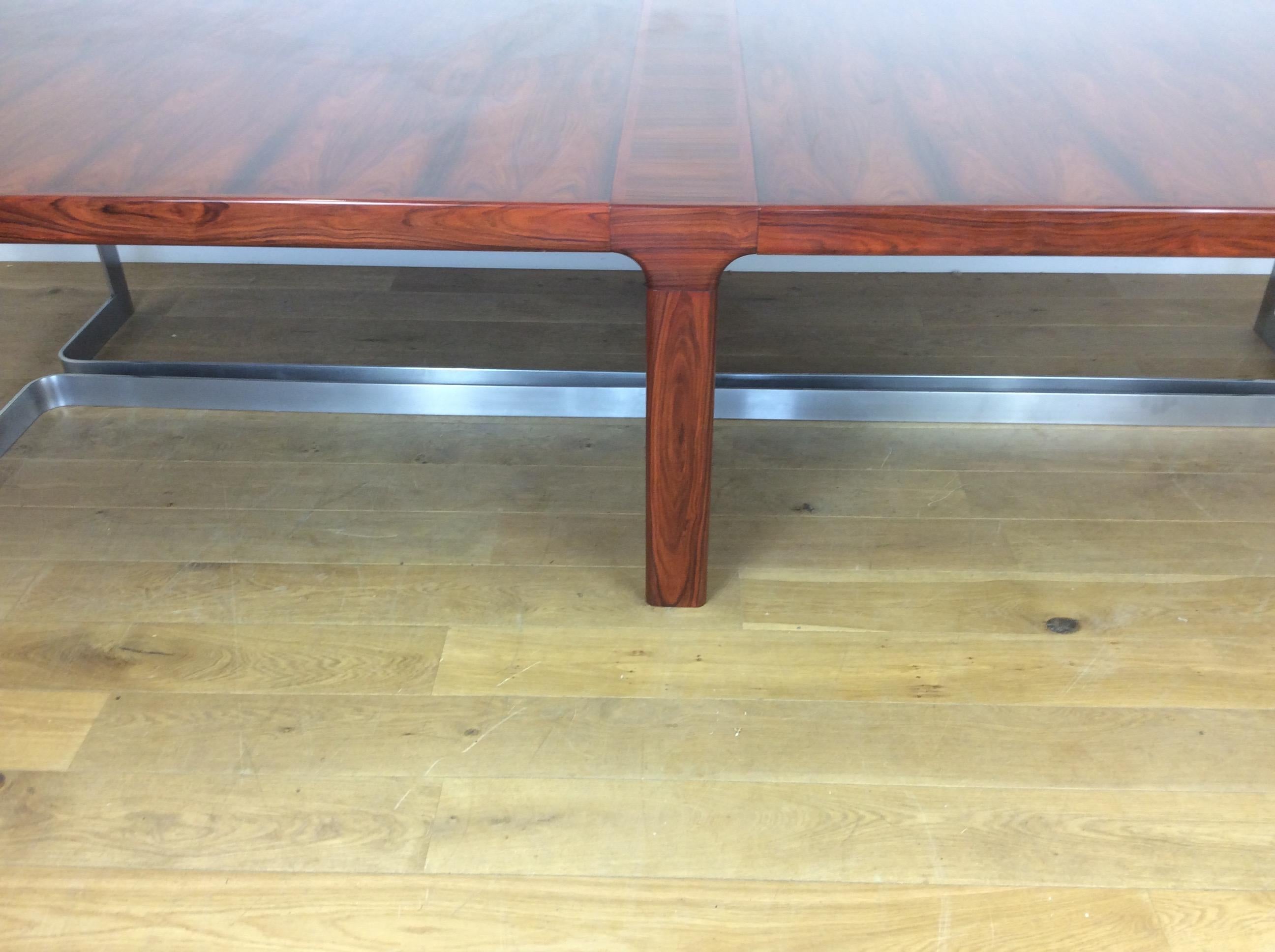 Midcentury rosewood conference table with polished steel support.
beautiful grain to this rich rosewood table, the table disassemble for ease of transport or re positioning.
Very high quality and beautifully crafted.
72 cm H 65 cm H to the bottom